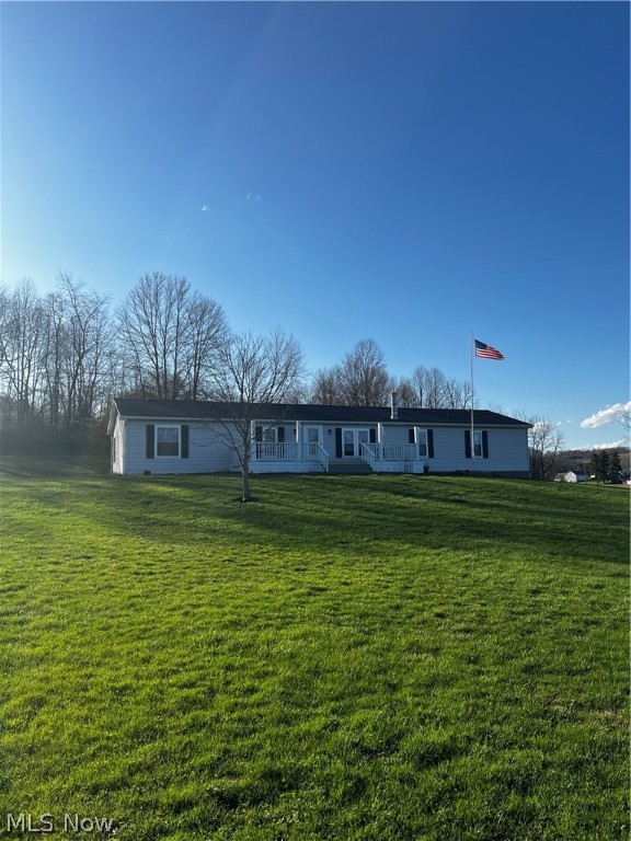 Welcome to this updated ranch style home situated on 2.3 acres of land just outside New Philadelphia.  If your looking for a peaceful retreat away from the city then this is it.  Many updates have been completed as follows.  The hot water tank, A/C unit, garage door , front and back door to the house, all carpet in bedrooms and living room, all lighting to include the outdoors and updated kitchen all in the past two years!  Roof is 8- 10 years ,  The Pella windows are 8-10 years and the furnace is about 8-10 years.  Make an appointment to come and this move in ready home today!
