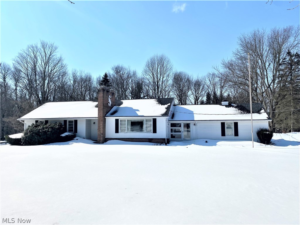 Charming Mid-Century Ranch on Almost 3 acres in beautiful Basswood Lake Preserve. This custom, one-owner home has been meticulously maintained and offers a light-and-bright dining/living room combo with 2 large picture windows and a sandstone fireplace.  The kitchen offers plenty of counter/cabinet space and the cabinets have been refreshed and refaced.  All three bedrooms have pristine wood floors and double-door closets.   The owner's ensuite has a vintage bath and the smallest bedroom has gorgeous wood-paneling which could make for a perfect home office.   The full basement has a roomy rec space with a wood burning stove.  The unfinished side is 31x22 and offers laundry space, tool/project space plus tons of storage.  The pull-down attic is sparkling clean and can be used for additional storage.  A breezeway/porch, back patio and two car garage complete this home.   Located in Basswood Lake Preserve (fishing, boating, kayaking, hiking, etc) and less than 5 minutes from Chardon squar
