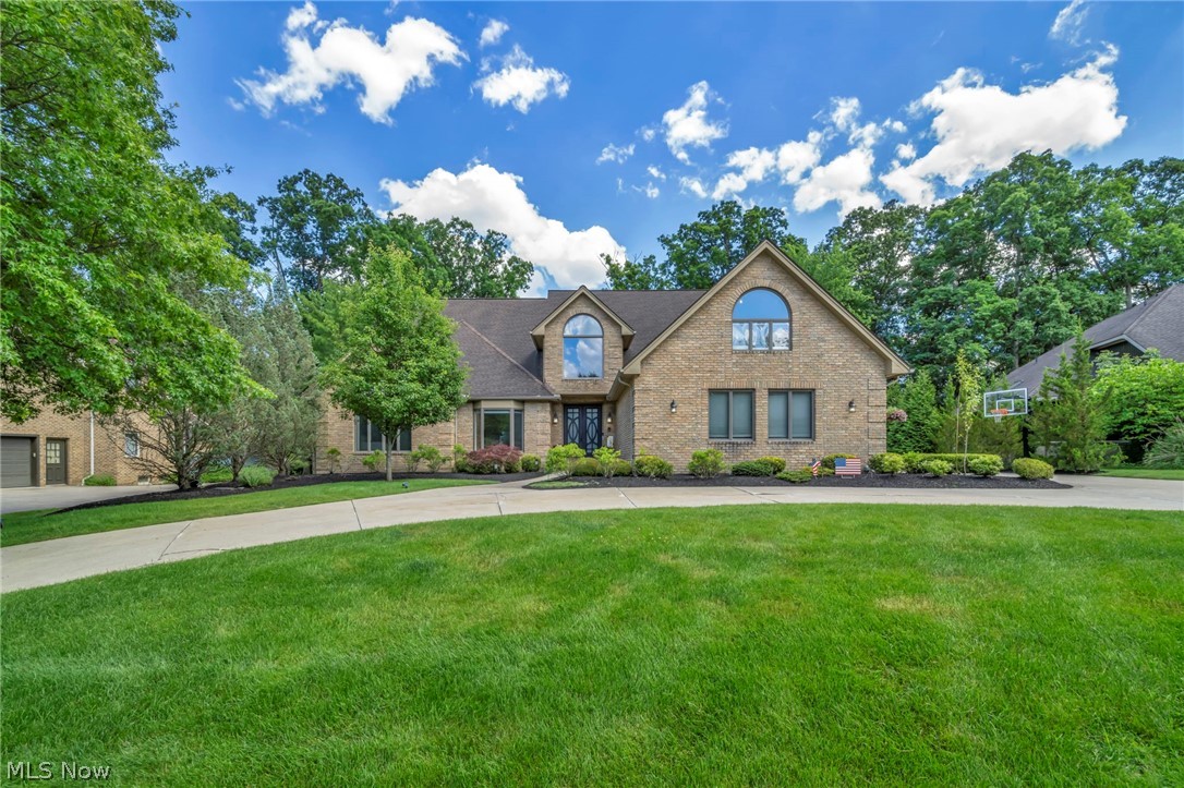 Welcome to this truly one-of-a-kind luxury residence nestled in Brecksville's prestigious Rockledge Estates, where over $460,000 in top-to-bottom renovations have transformed the home into a stunning turnkey retreat. Thoughtfully redesigned w/ exceptional craftsmanship & premium finishes throughout, this impressive 5 bedroom, 4.5 bath home blends timeless elegance w/ modern luxury.  A dramatic entry showcases a stunning imported Spanish front door,  Rich hand-scraped wood floors, custom floor-to-ceiling wainscoting, & exquisite Finelli Brothers wrought iron accents setting the tone for the quality found throughout. The executive office offers French doors, built-in bookcases, & custom millwork. The heart of the home is vaulted family room w/ stone fireplace, wet bar, 2 dining areas & a chef-inspired kitchen featuring custom cabinetry, a Bertazzoni cooktop, expansive quartz island & honed granite counters. Primary suite offers a vaulted wood-beam ceiling, heated hexagon tile floors, custom closets, soaking tub, & a spa-inspired dual-head rain shower. 3 more bedrooms, 2 full baths, a loft & bonus room are found upstairs. The finished walkout lower level provides w/ a huge wet bar, brick fireplace, recreation room, access outside to the patio, 5th bedroom, full bath & tons of storage space. Outside, the oversized 3-car garage w/ epoxy flooring, new garage doors & openers, phantom screen, & storage space. The beautifully landscaped grounds feature a horseshoe driveway, Hunter irrigation system, & a maintenance-free Trex deck overlooking the private setting. Remarkable $45,000 whole-home lighting upgrade, 2 new air conditioning units, 2 newer hot water tanks, & a newer furnace, providing peace of mind for years to come. This extraordinary Rockledge Estates residence offers an exceptional opportunity for the discerning buyer seeking a truly move-in-ready estate in one of Brecksville's most sought-after neighborhoods.