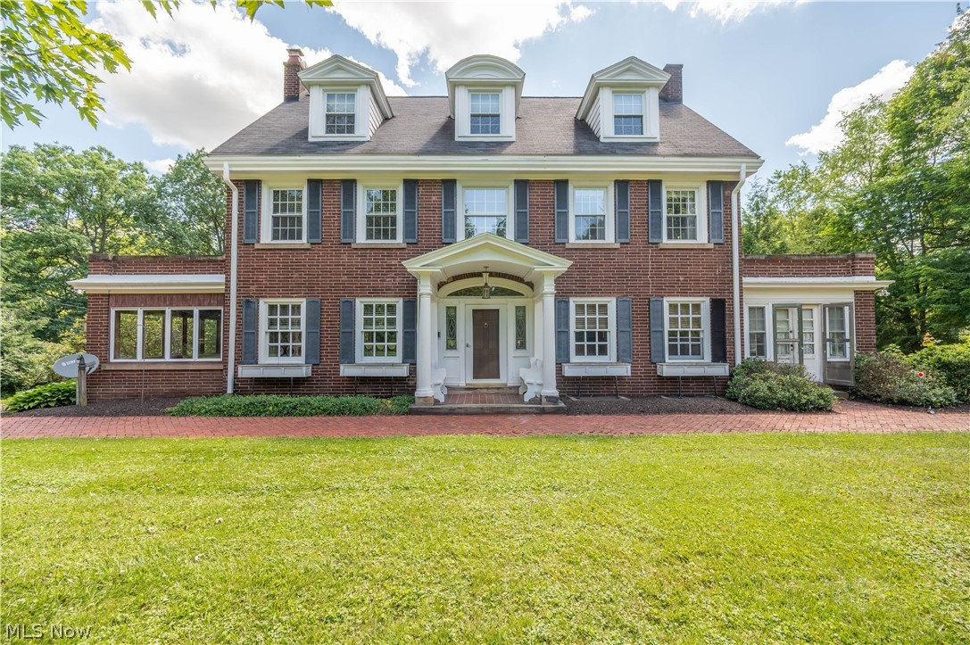 Magnificent Georgian Colonial built in 1916 offers timeless elegance and exceptional living space on 3.1 private acres adjacent to Youngstown Country Club. With 4,876 square feet above grade plus a substantial basement for storage, this one-of-a-kind residence provides three full floors of beautifully preserved living space.

A brick driveway with circular turnaround welcomes you to this stately home, where classic architecture and mature landscaping create unforgettable curb appeal. The grand entrance features the original front door with sidelights, opening to an impressive foyer and gracious entry hall showcasing detailed trim, and gleaming hardwood floors throughout.

Designed for both elegant entertaining and comfortable family living, the home offers four fireplaces, a large but inviting living room, formal dining room with gorgeous built-ins, wood paneled study and a spacious sunroom with a fireplace overlooking the grounds. The large kitchen includes a generous breakfast area and abundant workspace for daily living.

 The luxurious primary suite features a dressing room, private office, and en-suite bath. Seven additional bedrooms offer exceptional accommodations for family and guests. In total, the home includes eight bedrooms, three full baths, and three half baths. The private servant’s room provides flexibility as a home office or creative space.

Outdoor amenities include a beautiful stone patio, charming gazebo, expansive lawn, and mature trees that create a private, park-like setting. A detached 2 car garage in addition to a 2 car drive under, at rear of the home. 

Rich in architectural detail and filled with historic character, this extraordinary home is a rare opportunity to own a truly remarkable family estate. Offering timeless craftsmanship, exceptional space, and an unmatched setting, this is one of the area's most distinctive homes. Must see to appreciate the space and details.
