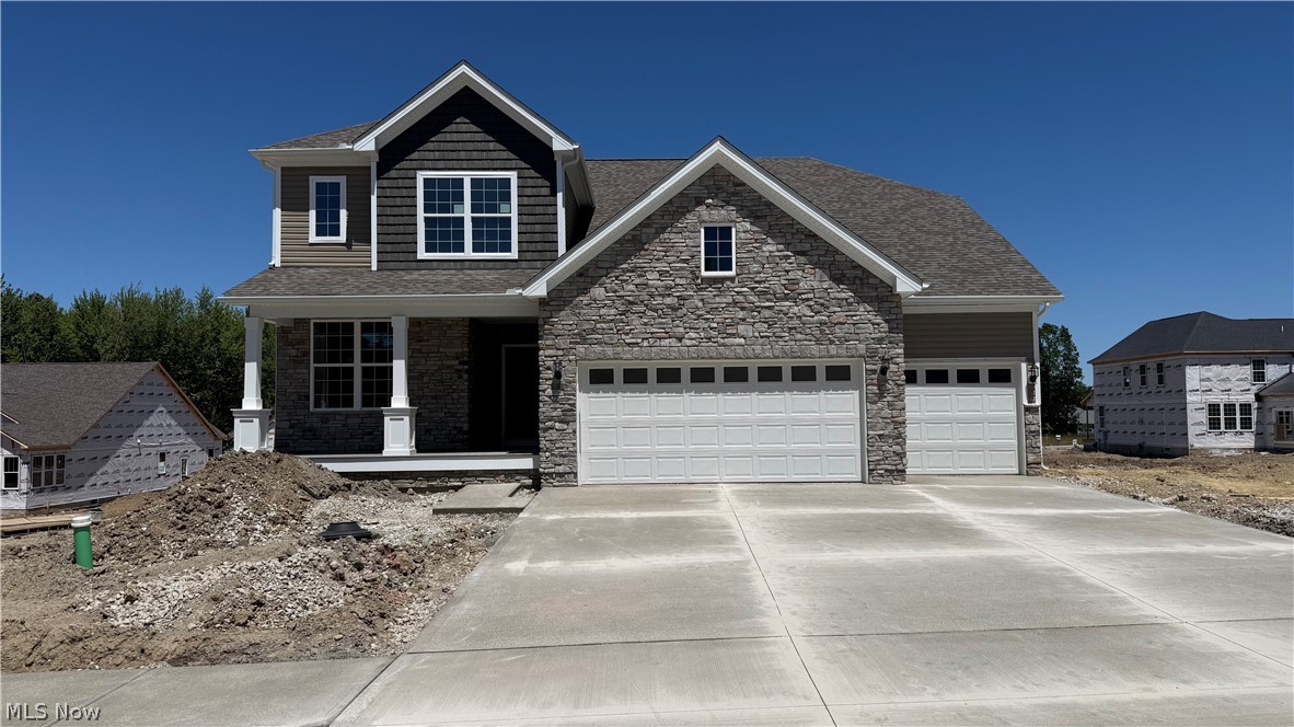 Move right into this stunning new construction home in the highly desirable Echo Hill Manor community in Mentor! Ready for immediate occupancy, this beautifully designed home offers the perfect combination of modern style, functionality, and location.
Featuring 4 bedrooms, 2.5 baths, Loft, and a spacious 3-car garage with extended depth, this home is loaded with premium upgrades throughout. The open-concept main level showcases 9-foot ceilings, a spacious gathering room with an extension for additional living space, a cozy gas fireplace, and a versatile flex room ideal for a home office, playroom, or hobby space. The gourmet kitchen is designed to impress with granite countertops, abundant cabinetry, kitchen island, hard-surface flooring, matte black finishes, and a Planning Center® for everyday organization. Upstairs, the luxurious owner’s suite features a tray ceiling, spa-inspired bath with quartz countertops, beautifully tiled shower walls, and a frameless glass shower door. Additional conveniences include a built-in laundry sink with cabinetry and numerous smart-home features. The expansive daylight basement offers incredible future living space with 9-foot ceilings, three rear windows providing abundant natural light, and a bathroom plumbing rough-in already in place for future finishing opportunities. Enjoy outdoor living from the welcoming covered front porch, extended driveway, and open backyard ready for your personal design and landscaping vision. Residents of Echo Hill Manor enjoy sidewalks, city utilities and lighting, and an HOA that includes high-speed fiber-optic internet and basic cable service. Perfectly situated directly across from Newell Creek Preserve and its scenic walking trails, this quiet South Mentor community offers convenient access to Interstate 90, Cleveland Clinic, Great Lakes Mall, shopping, dining, and Headlands Beach State Park, home to the largest natural sand beach in Ohio.