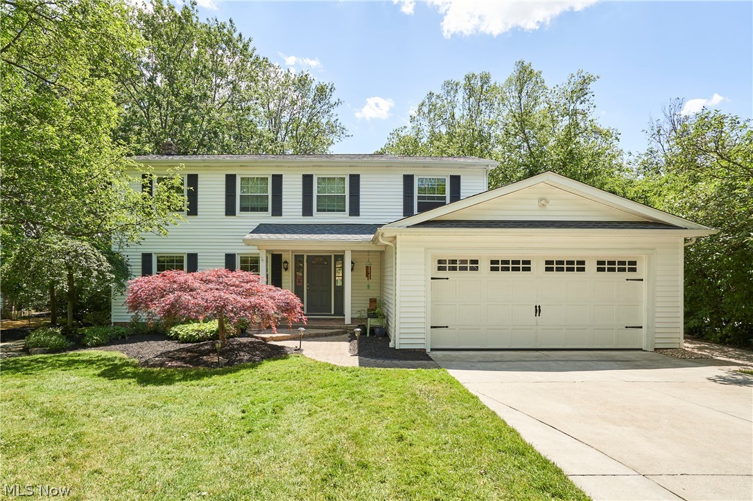Beautifully updated and well-maintained, this inviting home is tucked into a quiet neighborhood and welcomes you with a brick paver walkway and attractive landscaping. Inside, the open floor plan creates an easy flow from the living room to the dining room and then again from the kitchen to the family room, where a fireplace, wall of windows, and access to the two-tiered deck fill the space with natural light. The kitchen features a large island with a breakfast bar, granite countertops, and abundant cabinet and pantry space, while the 2019 addition just off the kitchen offers a mudroom, laundry room, extra storage, and a convenient desk area. Upstairs, an extra-wide staircase leads to four spacious bedrooms, including a primary suite with a beautiful built-in wood dresser and private full bath with a Jacuzzi tub and counter-height vanity, plus three additional bedrooms and another full bath. The finished rec room includes built-in shelving under the stairs, and the remaining basement space provides a second laundry area and plenty of storage. Outdoors, the backyard is an entertainer’s dream with a two-tiered deck and pergola overlooking a large yard with a built-in trampoline and fire pit. Recent updates include LVP flooring in the living room, dining room, and laundry room/mudroom (2020), reverse osmosis water filtration (2022), furnace and A/C (2023), new carpeting (2023), and a new roof (2026). Conveniently located near the Metro Park, freeway access, shopping, restaurants, and more, this home offers comfort, style, and everyday convenience. Don’t miss out on this one and call today!