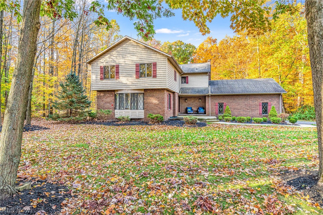 Extremely well kept 4 Bedroom, 3 Full Bathroom, colonial situated on a wooded 1.8 acre park-like lot with a beautiful pond stocked with fish in the front yard! This home has a gorgeous eat-in kitchen featuring Kraftmaid cherry cabinets, stainless steel appliances, a breakfast bar and bay window seat! Great open floor plan with sight lines from the kitchen through the family room with beautiful built in cabinetry, wet bar and remote-controlled gas fireplace! Updated full bathroom on the main level.  New front door opens to the entry foyer with hardwood flooring and open staircase.  The Dining room has two sets of beautiful French doors and chair rail molding.   Massive master bedroom with sitting area, walk-in closet, updated tiled glamour bath with whirlpool tub.  Walk-in closets in 3 of the bedrooms.  This home also features a screened-in porch with hot tub, New garage doors 2018, A/C 2018, HWT 2016, furnace 2016, updated flooring 2020, custom window treatments, a huge 10’x20’ shed, a