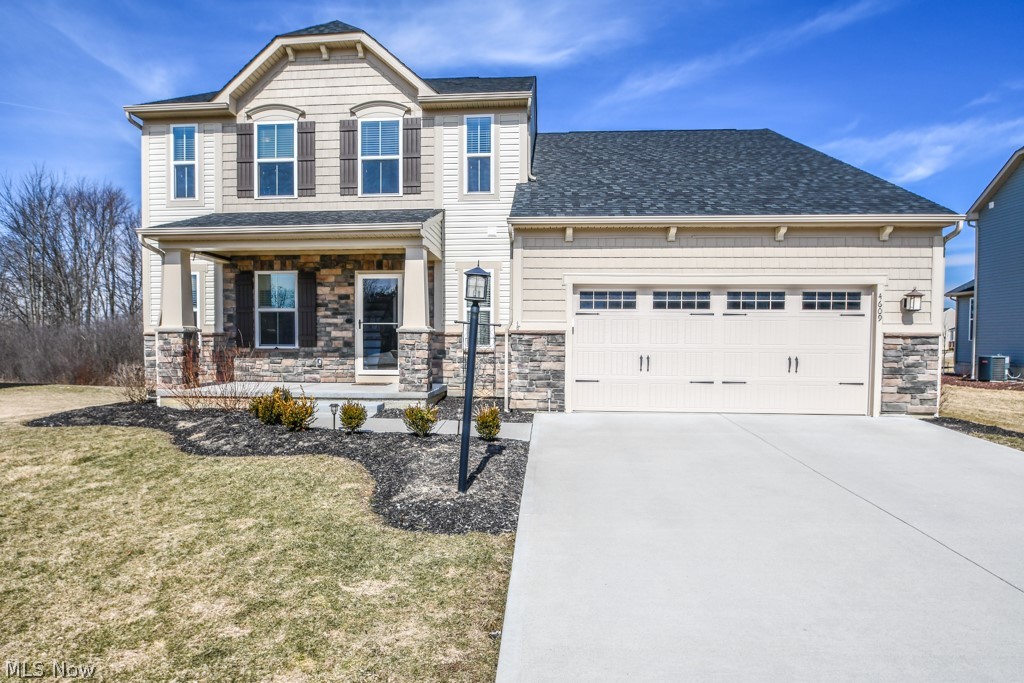 RARE FIND! New build with none of the hassles of building. Move right into this less than two year old home on a cul-de-sac with upgrades throughout.  All granite counters in the kitchen and baths. Entertain all of your guests or enjoy a quiet meal at your giant island. Gorgeous flooring includes hardwood steps with iron spindles. You will love having the laundry room on the same level as the bedrooms. Outside, this home is nicely landscaped saving you tons of money over building a home. The shed offers extra storage for lawn equipment or outdoor toys. Bonus: The builders warranty will transfer to you upon possession of this lovely house.