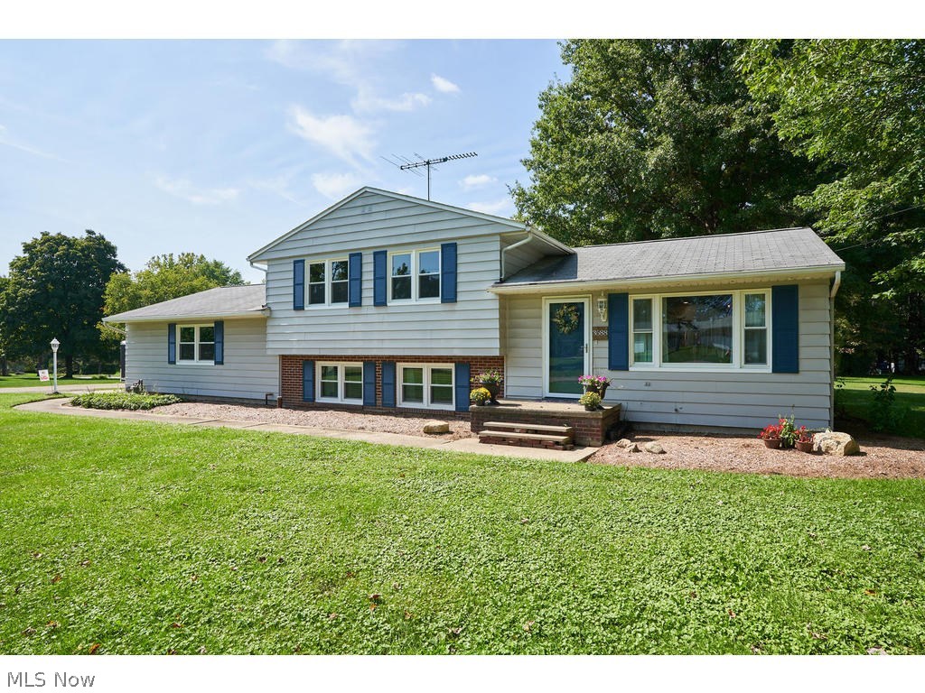 This renovated 3 bedroom 2 bath Cuyahoga Falls split level home is a show stopper. This incredible property is complete with refinished hardwood flooring, open and spacious kitchen, living and dining combination, new windows and so much more. The spacious kitchen offers a large island with brand new cabinetry, gorgeous tile backsplash along with new blue pearl granite counter-tops and new light fixtures. You will also notice that all kitchen appliances are brand new! You will love the custom master bathroom with new vanity and sink, subway tile backsplash, new flooring and light fixtures. The new vinyl deck is a perfect place to sit back and enjoy the large backyard. There is a two-car attached and a two-car detached garage, which make this home complete.