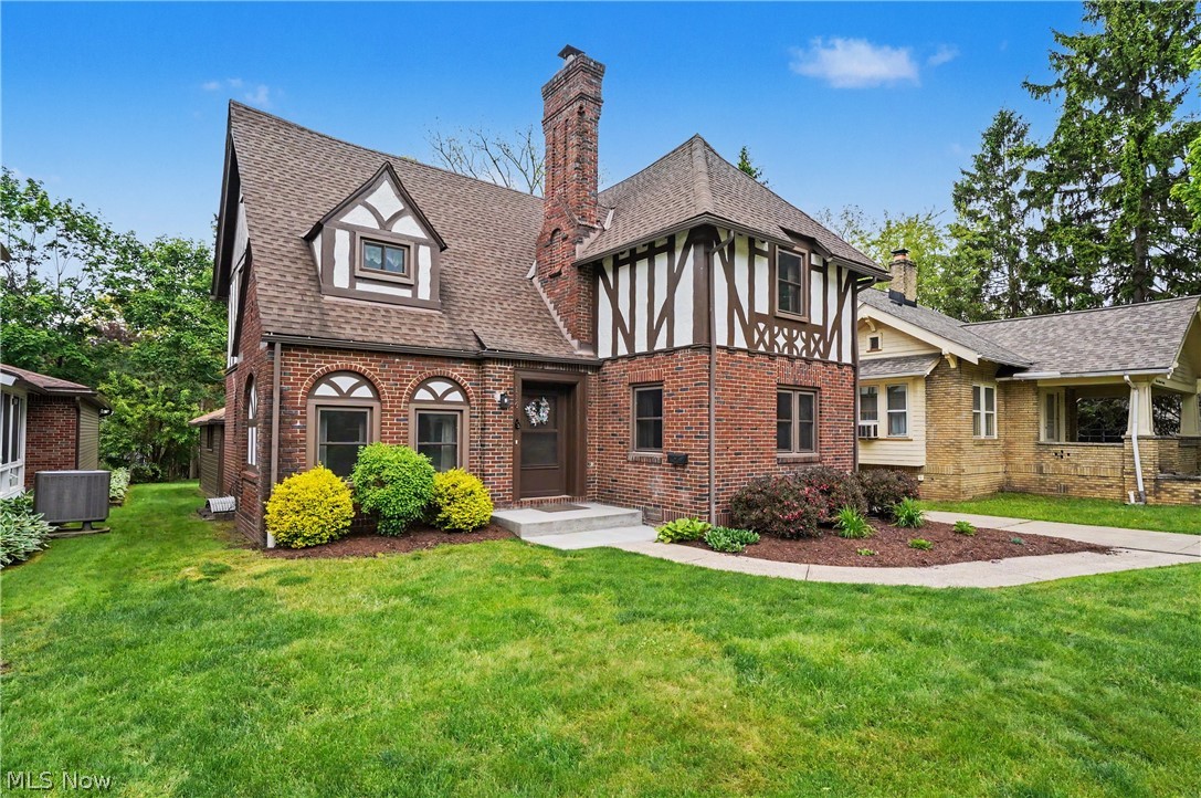 Visit this Exceptional Brick English Tudor Home situated in the Beautiful sought after Castle Park Neighborhood in West Akron. Sellers have updated and cared for this home since purchasing 20 years ago. Important updates include: Updated Kitchen in 2023 that included New Cabinet Doors, rebuild of all drawers, shelving, backsplash, beautiful Luxury Laminate Flooring, Microwave and Dishwasher. Other Stainless Appliances new in 2018. In 2023 same contractor remodeled 2nd Floor Bath with cutting edge materials. Same flooring as in kitchen was added to den/library. In 2024 Sellers tackled the finished basement with updates that included: remodel of full bath, replacement of drop ceiling, repainting and beautful plush carpeting, Plus, the newer Front loader Washer & Dryer are included in sale, along with all 2nd floor standing A/C units. Other improvements include: All Windows replaced in 2019 with quality Okna 800 series Windows. Dunrite Roof in 2014, Backyard Fencing in 2022, Upper part of exterior and garage repainted in 2025, along with full maintenance of living Room fireplace. In 2026 Living Room repainted and new Ceiling fans w/remotes added in Bedrooms. New Electrical Box in 2025. There's a breezy 3 Season Room between house &  2 Car Attached Garage. This Spectacular Home is ready to move in with Immediate Possession!