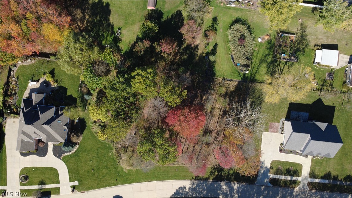 This rare .77-acre double lot in Broadview Heights offers the perfect setting for your custom home. Nestled on Village Drive, a quiet and private street lined with beautiful all-brick homes, this property provides both charm and exclusivity. A new build here must also be brick, ensuring a cohesive and timeless neighborhood aesthetic. Enjoy the convenience of public utilities available at the street and a prime location close to major highways, top-rated schools, shopping, and dining. Don’t miss this unique opportunity—contact the listing agent for more details!