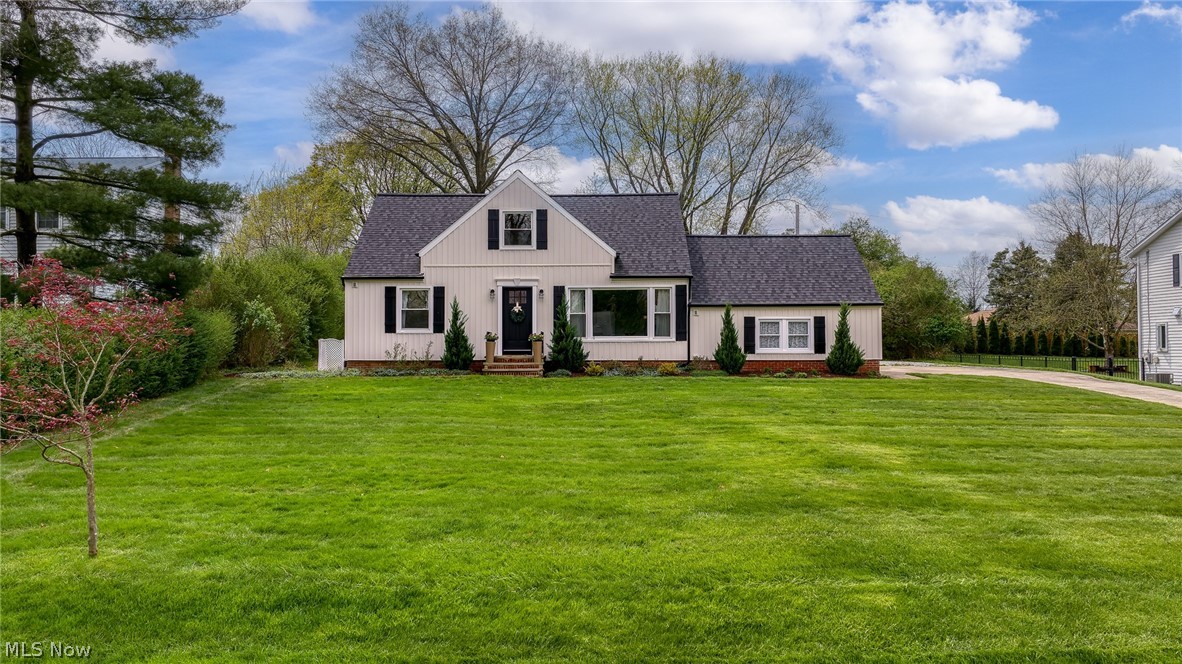 Welcome home to this beautifully reimagined Cape Cod, tucked right in the heart of Hudson, Ohio, just minutes from the charm of downtown, where morning coffee runs, Saturday farmers markets, and evening ice cream strolls become part of your everyday rhythm.

From the moment you enter, there’s an immediate sense of lightness; sunlight pouring through a wall of windows, dancing across freshly refinished hardwood floors, and guiding you effortlessly from one space to the next. The living room feels both warm and open, inviting you to settle in and stay awhile.

The living room flows effortlessly into the eat-in kitchen, a space that is as beautiful as it is functional, with quartz countertops, stainless steel appliances, and a gas range; all opening seamlessly into a vaulted family room designed for gathering. With its cozy gas fireplace and expansive windows, it’s the kind of space where everything naturally comes together.

Just off the family room, a covered patio creates the perfect setting for slow summer dinners and quiet mornings, all overlooking a private backyard that feels like your own little escape.

On the main level, two sizable bedrooms are paired with a thoughtfully renovated full bath, complete with heated floors and a walk-in shower, adding a layer of everyday luxury. Upstairs, you'll find a very spacious bedroom offering a peaceful retreat, with its own beautifully updated bath.

The unfinished lower level holds endless potential, whether you envision a media room, home gym, playroom, or a space that evolves with you over time.

But what truly sets this home apart is the life waiting just beyond your front door. This is a neighborhood where neighbors know your name, where block parties turn into lasting friendships. Paired with the best of what Hudson has to offer with Cascade Park and Historic Main Street being less than a mile away. This home offers a lifestyle rooted in connection, warmth, and community.