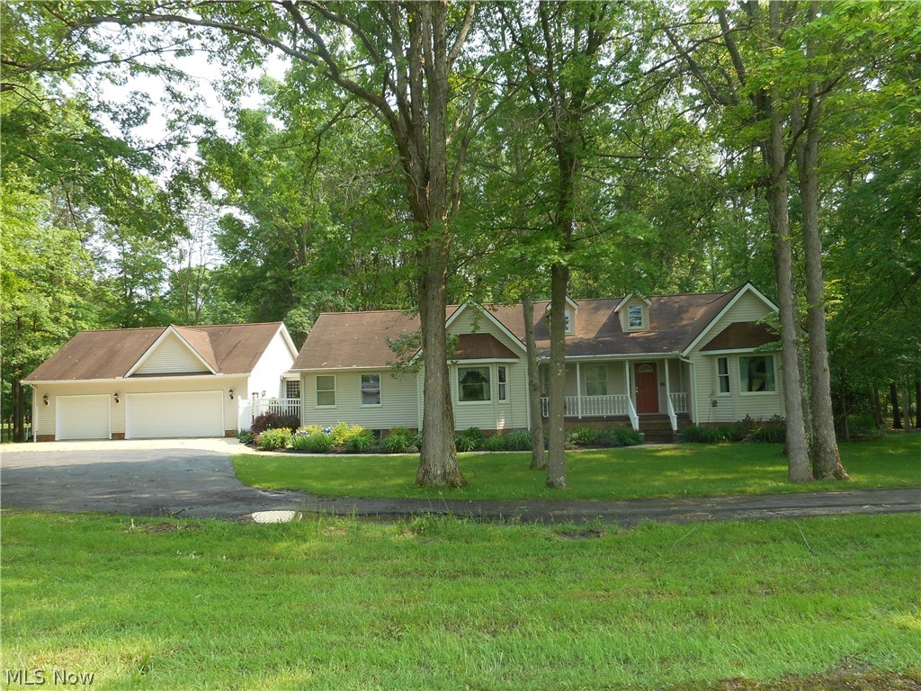 Enjoy peace and tranquility in this lovely 3 bedroom ranch situated in a beautiful 5 acre country setting.  The vaulted Great Room offers recessed lighting, wood burning fireplace and features two sets of french doors that leads to the four season vaulted sunroom with two skylights that brings the natural lighting indoors or to the spacious deck.  In addition, the sunroom features french doors to the deck so this would be the perfect home for entertaining this summer.  Screened in porch is 10 x 30 and offers exceptional space to enjoy the morning with your cup of java while overlooking the pond and catching a glimpse of some passing deer and other wildlife. Spacious and open kitchen offers plenty of cabinet and counter space with stainless steel appliances, pantry & large eating area and is open to the dining room/great room.  The master bedroom is ensuite with jacuzzi, walk-in closet and walk-in shower.  The other two bedrooms are good size with nice closet space.  The convenience fir