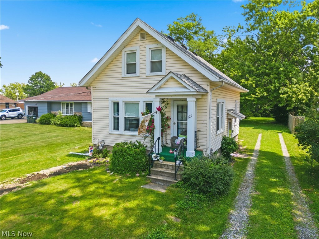 Enjoy Lake Erie views from the comfort of your living room in this charming 2-bedroom, 1.5-bath home situated on a spacious 0.39-acre lot. Filled with historic character, this home features beautiful wood floors, built-in bookshelves, and timeless architectural details throughout. The large detached 2-car garage offers additional storage with a full attic space above. Conveniently located within walking distance of a boat launch, library, city park, community pool, and highly regarded local schools, this property offers an exceptional lifestyle both indoors and out. Major updates provide peace of mind, including newer windows throughout, a brand-new sewer line to the street, basement structural reinforcement with beams and supports, and a professionally waterproofed basement complete with sump pump. A rare opportunity to own a well-maintained home with character, updates, and Lake Erie views.