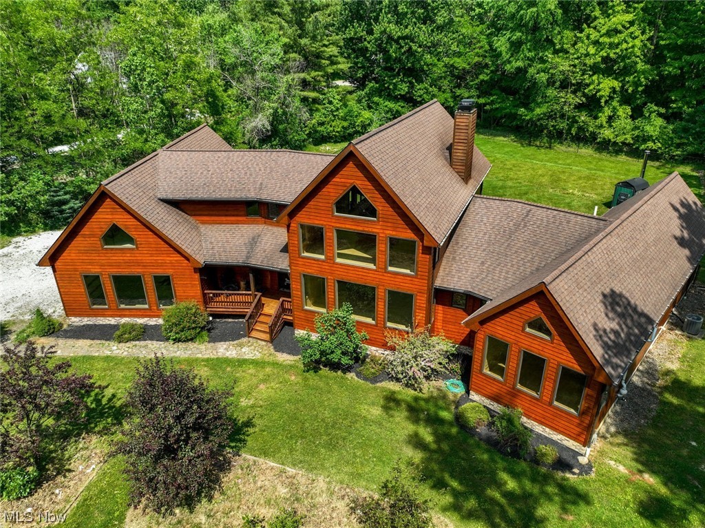 PLEASE SEE VIRTUAL TOUR VIDEO ATTACHED. PICTURES INCLUDED.  Looking for a beautiful, spacious home tucked away on a scenic road?  THIS IS IT !  Nestled on 4.5 acres this cedar ranch has walls of windows to enjoy Mother Nature at her finest.  Walk up to the front door and you can picture some chairs there as another place to enjoy morning coffee and serenity.  Open the  front door and be welcomed to an open floor plan with soaring ceilings.  The huge fireplace is a beautiful focal point.  Large open eat-in kitchen where conversations don’t get lost from the great room.  Granite countertops, hickory cabinets, breakfast bar and a large eating area surrounded by windows.  The pantry is every cook’s dream!  Sliders to the deck.  Another great place for morning coffee!  First floor master bedroom offers another fireplace and hot tub to soak away the weary days. Two more bedrooms and the laundry room complete the first level.  Look up and see the large open loft.   Great venue for an office,