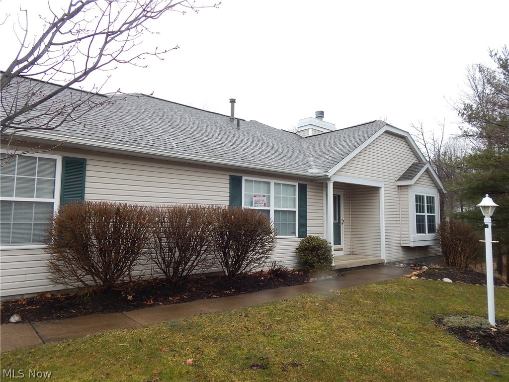 Look Beyond the Ordinary! Beautiful 3 Bedroom, 3 Bath Ranch style condo! First floor offers 2 BR, vaulted Great room. Additional heated Sun room off the rear overlooking beautiful nature. Trees, stream and green space. Lower level offers Bedroom, full bath, Recreation room with walk out feature to covered patio. Full size storage area. Condo features first floor living incl. first floor laundry, two car attached garage. Very secure low traffic cul de sac location. 
Vibrant design for the step saving life style. Need a few updates but the kitchen cabinets are newer, central air is newer and freshly installed living room carpet.