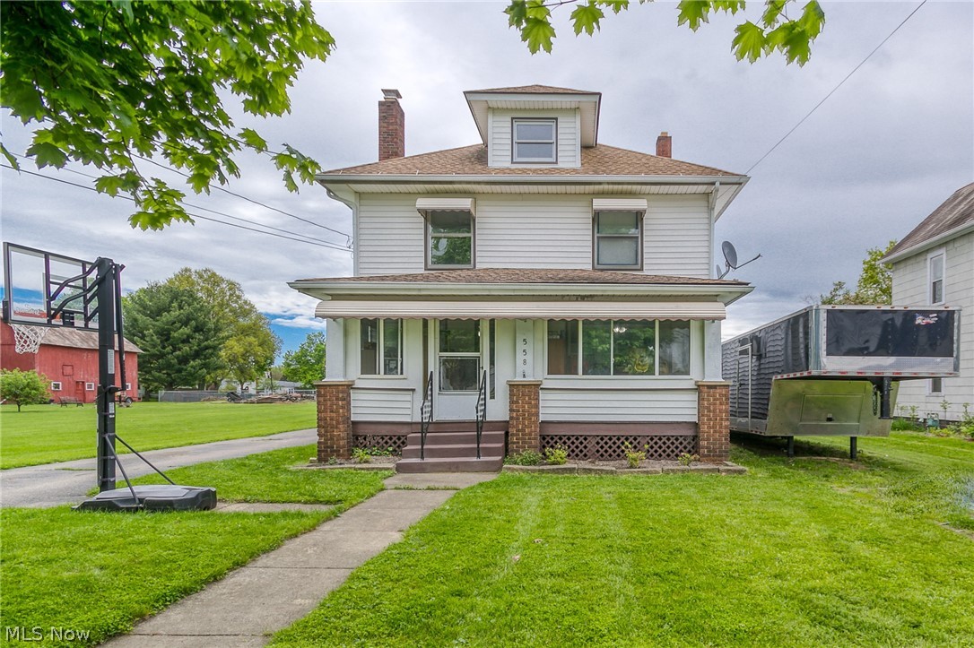 If you've seen it from the road, you know you're intrigued and if you haven't you will be...trust us. Some things must be seen to be fully appreciated and we think you'll agree that this property is too special to simply drive-by. When you get out of the car, we know you'll want to explore the 40x48 garage big enough to store all your recreational toys. It is ginormous with 17 ft. ceilings, water, electric, concrete floor, partial loft and car lift (included). Don't ask yourself, "what would I do with a building that big?!", the better question is "what couldn't I do with it?" On your way to the front door check out the additional 2-car detached garage. As you enter the home through the enclosed front porch, you are greeted with an open-floor plan with hand-hewn barn beams, fantastic spacious closet with hand-made barn doors, a wood burning fireplace, fresh contemporary paint and new floor coverings. The kitchen has freshly painted cabinets, a new backsplash and a cute cubby for the re