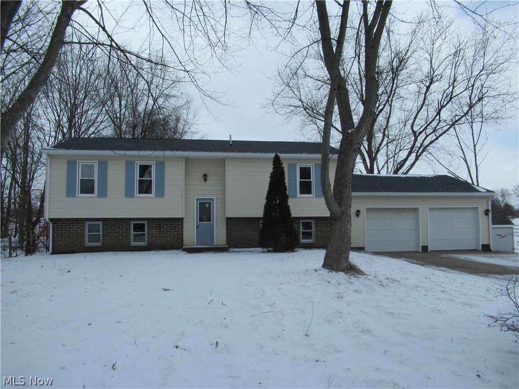RECENTLY RENOVATED 3 OR 4 BEDROOM, 2 FULL BATH HOME IN NORTH CANTON.  This one has too many updates to list all and truly is a must see at this price!  New roof, kitchen, bathroom, windows, A/C, flooring, paint and more.  This open floor plan has a large eat-in kitchen w/a slider to the back deck w/fireplace.  Lower level is finished w/fireplace, full bath w/large jetted tub w/brick surround, and an office or 4th bedroom.  Two car attached garage.   Large open side yard w/storage shed.  Call for complete list of updates.  This one is truly a  must see and will make a great house to call home.