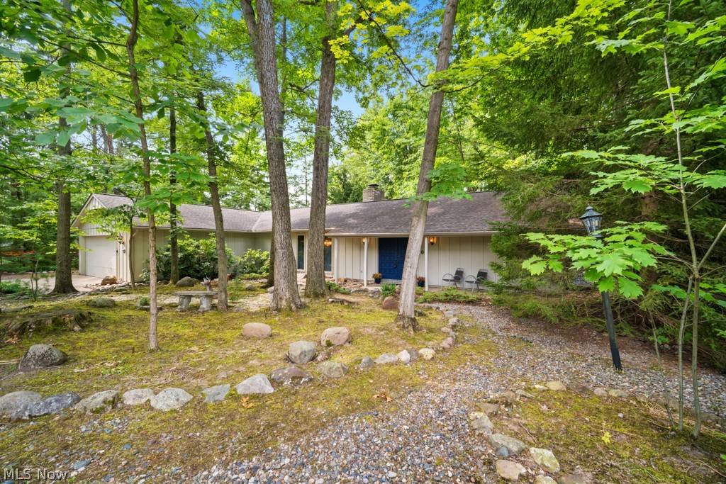 Stunning Wooded Ranch Backing to the Metroparks in Forest Park! Rarely does an opportunity like this become available in one of Strongsville's most sought-after neighborhoods. Nestled on a private wooded cul-de-sac lot & backing directly to the Metroparks, this meticulously maintained original-owner ranch offers the perfect blend of privacy, natural beauty & convenient one-floor living. Featuring approximately 2,000 square feet, 4 spacious bedrooms & 2 full bathrooms, this home boasts a thoughtfully designed floor plan with private primary suite retreat complete with a striking beamed ceiling, oversized walk-in closet &  en-suite bath. 3 additional generously sized bedrooms are situated on the opposite side of the home, creating ideal separation for  guests. At the heart of the home, a stunning double-sided wood-burning fireplace connects the living room & family room, creating warm, inviting spaces for gathering & entertaining. Large windows throughout showcase peaceful wooded views and abundant wildlife, bringing the beauty of nature indoors year-round. Pride of ownership is evident throughout, with numerous recent updates including fresh interior paint, newly stained exterior, new gutters & new heat pump. Dual HVAC systems have been meticulously maintained & all appliances—including the washer & dryer—are included, making this truly move-in ready. Step outside and enjoy the serenity of your backyard oasis while still being just a short walk from Forest Park's exceptional community amenities, including a swimming pool, tennis courts, pickleball courts, and clubhouse. Located within the award-winning Strongsville City School District and just minutes from I-71, I-480, the Ohio Turnpike, shopping, dining, Cleveland Hopkins Airport, and downtown Cleveland, this home offers the perfect combination of convenience and tranquility. Move-in ready, beautifully maintained, and set on one of the finest lots in Forest Park— Schedule your private showing today.
