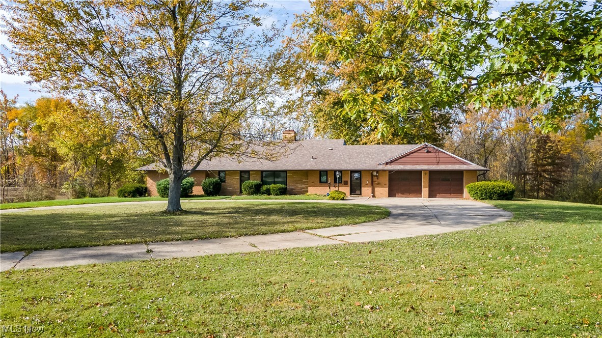 Beautiful 7.7-Acre Property in Prime Strongsville Location! Set on a stunning 7.7-acre lot, this 2,020 sq. ft. ranch-style home offers space, comfort, and modern updates in a serene natural setting. Inside, you’ll find 3 spacious bedrooms, 2 updated full baths, and an open floor plan connecting the living, dining, and eat-in kitchen areas perfect for entertaining or everyday living. A see-through wood-burning fireplace warms both the living room and family room, while large windows fill the home with natural light. Step outside to enjoy the expansive property ideal for gardening, barbecues, or unwinding while taking in the scenic surroundings. Horses are permitted, adding to the property’s versatility. The attached oversized two-car garage includes convenient walk-up attic storage. Recent updates include new windows and flooring (2025), HVAC (2024), hot water tank (2024), electrical (2022), and gutters (2024). Prime Strongsville location near schools, parks, shopping, and recreation, with easy access to I-71 and downtown Cleveland. A rare find combining acreage, privacy, and convenience.
