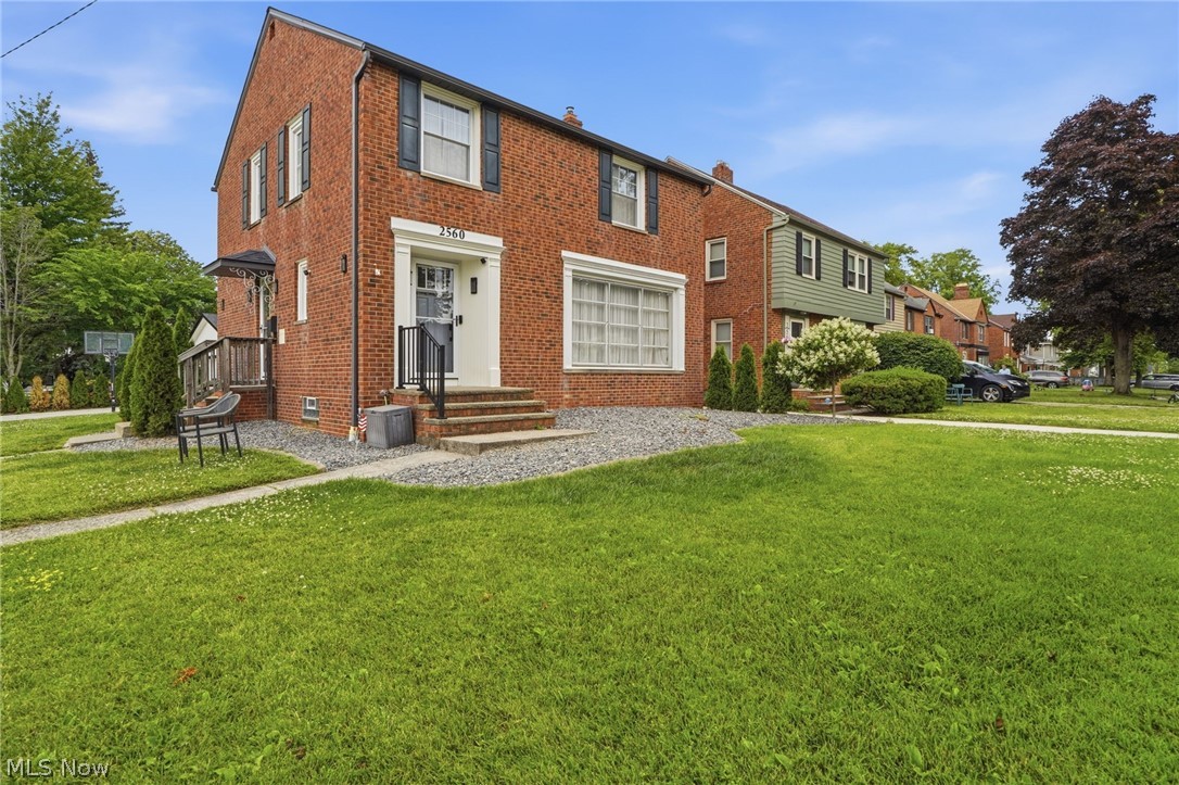Beautifully renovated brick home on a prime corner lot in a sought-after University Heights location. This one-of-a-kind home offers incredible curb appeal, a new driveway, attractive rock garden beds, and a beautiful backyard featuring a new stamped patio, pergola, cozy neon lighting, and an expensive custom sukkah designed for the pergola. Step inside and be blown away by the updates and attention to detail throughout. The home has been transformed into a bright, open-concept layout with a welcoming foyer, large living room, open dining room, and gorgeous kitchen featuring granite countertops, stainless steel appliances, beautiful backsplash, and modern ceiling paneling. Off the dining room is a stunning family room with cathedral ceilings, perfect as an extra living space, office, playroom, or bedroom. Detailed moldings, carefully selected chandeliers, beautiful shades, and elegant curtains add style throughout. A gorgeous updated powder room completes the main floor. Upstairs, ceilings have been adjusted for added height with moldings throughout. The second floor offers three spacious bedrooms, including a primary bedroom, plus a large remodeled bathroom with beautiful tilework, soaking tub, and separate shower. A chandelier in the upstairs hallway adds another elegant touch. The amazing finished basement includes a cozy living area, additional bedroom, and a gorgeous brand-new full bathroom tiled from top to bottom. The updated utility and laundry area is clean, attractive, and functional. Outside, enjoy a built-in basketball hoop and a fully gutted and redone brick two-car detached garage with drywall, attractive flooring, and a finished attic. An attached shed adds extra storage. Previously gutted to the studs, this home features updated electric, plumbing, windows, and newer mechanicals. Seller is offering the home furnished, making this a move-in-ready opportunity with no need to bring anything along. There is no house like this in University Heights!