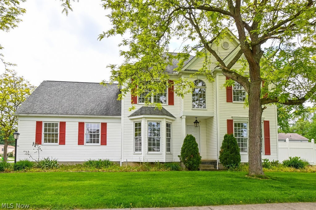 This spacious one-owner Colonial in desirable Mogadore neighborhood was custom built by the family and lovingly maintained for years, offering over 2,300 square feet of comfortable living space ready for your personal touch. Situated on a corner lot, the home features beautiful Brazilian hardwood flooring throughout the first floor, oversized windows that fill the home with natural light, and charming pop-out front windows that add character and curb appeal. 

Designed for both everyday living and entertaining, the dining room showcases dramatic floor-to-ceiling windows, while the kitchen and living area feature a wraparound breakfast bar and a second set of French doors leading to a hardscaped outdoor dining space and enclosed backyard. A first-floor office/bonus room offers flexibility and could easily serve as a fourth bedroom, while the convenient first-floor laundry room adds functionality.



Upstairs, the extra-spacious owner’s suite includes two closets, dual sinks, vanity area, stand-up shower, and soaking tub. Additional storage abounds with two hall closets upstairs and two jumbo closets on the main level. The massive unfinished basement offers incredible storage and multiple rooms that could be finished for additional living space, recreation, or a home gym.

Car enthusiasts and hobbyists will appreciate the oversized 2.5-car garage featuring extra-high ceilings, abundant storage space, and a convenient man door. With mature landscaping, a fenced backyard, and room to make it your own, this well-cared-for home combines size, functionality, and long-term pride of ownership in the highly regarded Mogadore Local School District.  ***Stove range 2024 , Refrigerator 2023 , AC unit 2022, Furnace blower unit 2022, Water Heater 2022, Dishwasher 2024***