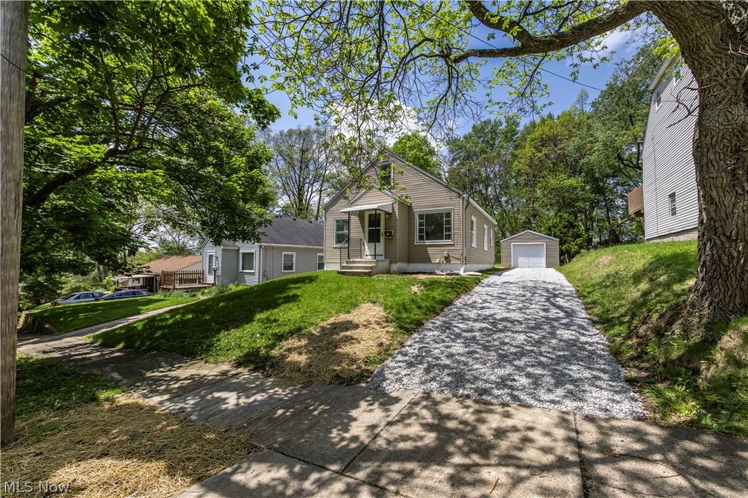 Welcome to 144 Malacca St. in the heart of desirable Goodyear Heights! This completely remodeled 3-bedroom, 1-bath Cape Cod is the definition of move-in ready and packed with updates from top to bottom. Situated on an extra deep lot with a partially fenced backyard, this home offers the perfect combination of charm, functionality, and modern finishes. Exterior features include vinyl siding, architectural shingle roof, vinyl replacement windows including several recently replaced within the last six months, and a brand new garage door with opener on the detached 1-car garage. Inside, you’ll love the stunning brand new kitchen featuring soft-close shaker cabinetry, quartz countertops, subway tile backsplash, and stainless steel appliances. The fully renovated bathroom has been updated from top to bottom, while the entire home showcases fresh interior paint, all new luxury vinyl plank flooring and carpet, plus updated fixtures and hardware throughout. The main level offers two spacious bedrooms and a beautifully updated layout, while the second floor features an oversized third bedroom with abundant closet and storage space. The professionally waterproofed basement adds even more usable living space with a finished rec room perfect for entertaining, hobbies, or a second living area, along with new glass block windows for added efficiency and peace of mind. Additional major updates include a brand new water line from the street to the house, brand new gravel driveway, and fresh landscaping. Truly nothing to do but move in and enjoy. Don’t miss this incredible opportunity!