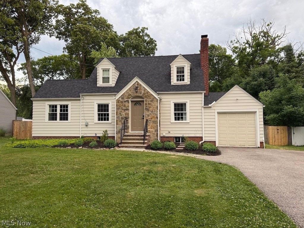 Welcome to 2350 Hillside Road — a thoughtfully updated Cape Cod tucked into a quiet, established neighborhood where pride of ownership shows at every turn. The stunning new kitchen is the heart of the home, featuring white shaker cabinets, moody cloud quartz countertops, and a charming sun-drenched breakfast nook framed by oversized windows with backyard views — the kind of spot you'll linger over coffee every morning. Gleaming hardwood floors flow through the bedroom areas, while fresh LVL throughout the rest of the home delivers a clean, cohesive look from room to room. Three bedrooms offer flexible living — two upstairs plus one conveniently located on the main floor, ideal for guests, a home office, or multi-generational use. Both bathrooms have been refreshed with stylish finishes. Step outside to a fully fenced, spacious backyard — perfect for entertaining, pets, or simply unwinding in your own private retreat. Major systems have all been addressed so you can buy with confidence: new roof (2025), new hot water tank (2025), new furnace & AC (2022), and city sewer tie-in (2025). The heavy lifting is already done — all that's left is to make it yours.