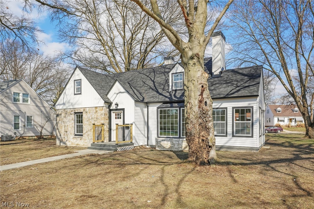 Welcome to 8612 W Moreland Rd in Parma, a completely renovated 4-bedroom, 2.5-bath home where every detail has been thoughtfully updated. The home sits on a large double lot. With a new roof, siding, windows, & furnace in late 2025, and new central air, dishwasher, disposal, concrete driveway and walkway all in 2026, this home offers both modern style and long-term peace of mind. Inside, new luxury vinyl plank flooring runs throughout, creating a clean and cohesive feel from room to room. Upon entry, you’re welcomed by a spacious living room drenched in natural sunlight from large windows, anchored by a cozy fireplace. The living area flows seamlessly into the kitchen and designated dining space, where sliding glass doors lead out to a composite deck, perfect for outdoor gatherings. The kitchen is sleek and contemporary, featuring stainless steel appliances, gold fixtures, a breakfast bar for additional seating; a layout designed for entertaining. A versatile sunroom and mudroom adds extra function to the main level. The first-floor primary bedroom is generously sized and shares a beautifully updated full bath with a second main-level bedroom. Upstairs, two additional spacious bedrooms with ample closets share another full bath. The finished basement includes a half bath, laundry area, and expansive living space perfect for recreation, a home theater, or additional entertaining. With its total rehab and thoughtful layout, this home is truly move-in ready. Schedule your private showing today!