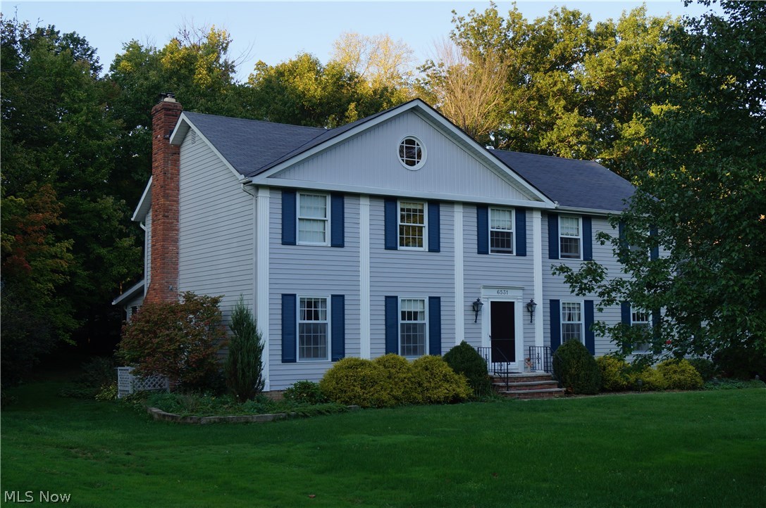 Come see this well-maintained, beautiful center hall colonial in one of the most desirable neighborhoods in Solon. The spacious home features 5 bedrooms and 2.5 bathrooms. Beautiful oak hardwood floors are present throughout the upstairs; featured in two of the bedrooms including the master. All five bedrooms have fresh paint, new switches and outlets. The first floor features a laundry room with a dual-well deep sink, a morning room / office, large living room, dining room and family room with wet bar and fire place. The family room opens to a 3-season sun porch with stunning Jalousie windows and a connecting deck. Kids will love the wooded lot, small ephemeral creek running through the backyard and easy access to 3 cul de sacs. The home features double insulation in the attic, a 2-stage furnace, upgraded electrical equipment and fresh exterior paint (2016). Refrigerator, range, cooktop, washer, dryer convey. Playset negotiable.