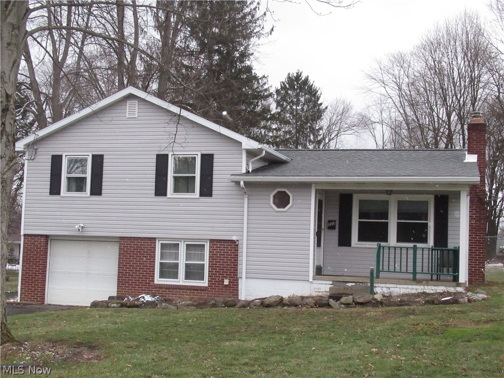 This split-level, 3-bedroom home is located in the heart of Canfield. The entry foyer features a coat closet and updated laminate flooring, which extends into a spacious living room complete with a ceiling fan and a decorative electric fireplace. The eat-in kitchen includes updated upper cabinets, laminate flooring, and sliding doors that lead to the backyard. All appliances are included. The second level offers three bedrooms; two feature carpeting, while the third has updated laminate flooring. This level also includes a full bathroom with ceramic tile flooring. The lower level provides a versatile bonus room with ceramic tile floors, ideal for an office or additional storage, alongside a laundry area with a washer and dryer that stay with the home. Key updates include a new roof and siding (2024), a new furnace (2025), updated electric box with 100 amp, lower-level flooring, upper kitchen cabinets, and freshly painted. The property also features a one-car garage and a generously sized lot. Please call today to schedule your private showing.