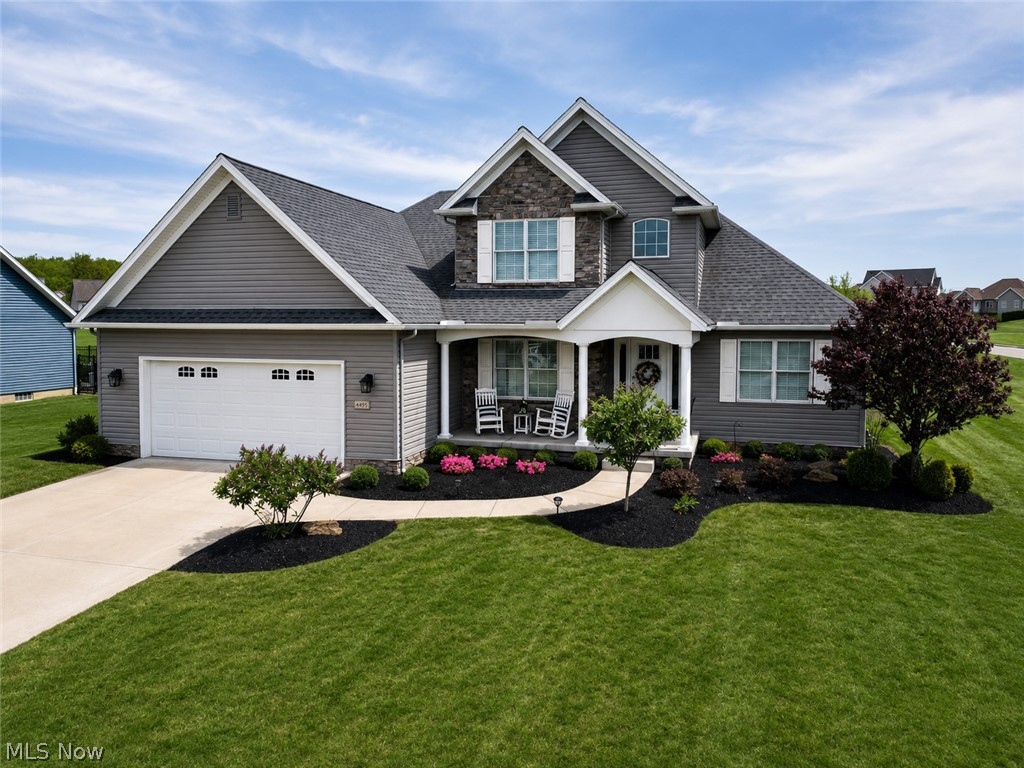 MOTIVATED SELLER! This beautiful 3-bedroom, 3-bathroom home is located in the very desirable Summer Winds neighborhood in Canfield TWP and Canfield LSD! Just built in 2019 and situated on a corner lot, this home is right down the street from the neighborhood clubhouse which has a heated indoor pool, fitness room, and community room! Enjoy the well-kept, low maintenance landscaping while relaxing on the covered front porch on these summer mornings. When you go inside, you'll be greeted by a den with glass French doors off to the left and a cathedral ceiling in the main living area with gas stone fireplace that leads directly to the open floor plan dining and kitchen. The cabinets are a gorgeous white high-end detail with an island and granite countertops! Updated lighting, stainless-steel appliances, plenty of counterspace and a pantry for extra storage! An enclosed sunroom off the dining area would be great for an office, playroom, or another living space! This leads out to the concrete patio which is great for entertaining! The master bedroom resides on the main floor with a huge walk-in closet and attached en-suite with stand-up shower! A half bathroom and laundry room with sink and cabinetry are off the kitchen area along with a cute mud room bench near the garage door! Upstairs has 2 large bedrooms and a full bathroom with tub-surround and granite counters! The basement has just been beautifully finished with Lifeproof flooring, black-out ceiling, chevron barn doors and plenty of storage! This finished area gives you over 900 sq. ft. of extra living space and a few areas for a multi-functioning basement! This is one you absolutely won't want to pass up!