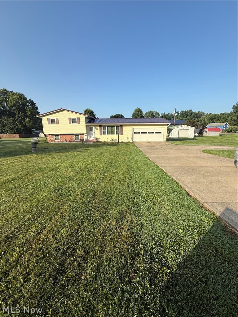 Welcome home to this well-maintained 3-bedroom, 1.5-bath split-level located in the desirable Riverview School District! Conveniently situated on a half an acre just minutes from shopping, dining, and everyday amenities, this move-in-ready home offers an attached 2-car garage plus an 18' x 20' pole barn and a 10' x 20' Amish-built storage shed with loft—perfect for extra storage, hobbies, or a workshop. The kitchen features custom cabinetry, offering both style and functionality Major updates include a metal roof and siding (approximately 5 years old), replacement windows throughout (upstairs windows 2021), new back door (2022), new concrete driveway and garage floor with a durable non-slip epoxy coating, updated crawl space flooring, second furnace, new kitchen sink, two new toilets, new bathtub, and removal of popcorn ceilings with fresh paint throughout. The basement has been professionally sealed and has remained dry.Don't miss this beautifully updated home offering space, storage, and peace of mind with numerous improvements already completed!
