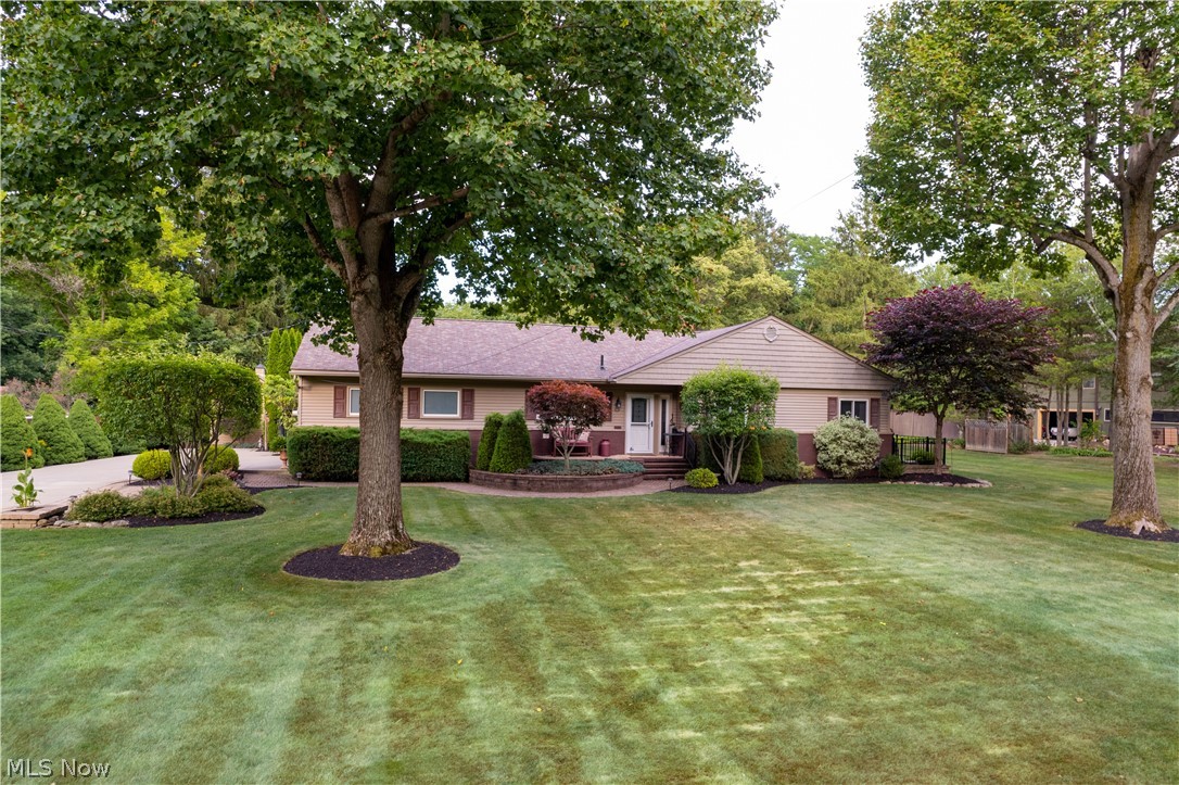 Beautifully updated & meticulously maintained inside & out, this Ranch home abutting the Oneil Woods Metro Park/Cuyahoga Valley National Park is sure to go fast!  The bright & open floor plan has great views throughout of the professionally manicured gardens & grounds and 32' x 16'  heated inground pool.... like being on vacation in your own back yard!   The Kitchen features custom Schrock cabinetry, granite countertops, stainless steel appliances, & breakfast bar open to the living room.  Other upgrades include gorgeous hardwood flooring, custom interior doors and large glamour bath.  The Sun/3 season room leads to the patio featuring a Sunsetter awning---offering a relaxing place to entertain family & friends.   The lower level includes a spacious Rec room with Miracle Stone 
flooring --fireplace---2nd full bathroom--utility area with updated mechanicals.  Outside features include newer concrete drive, fencing, landscaping, pool shed with pool equipment, garden shed, & updated well & septic.  This home is located in the highly desirable Revere School District too!
Call today for your private appointment.... you'll be glad you did!