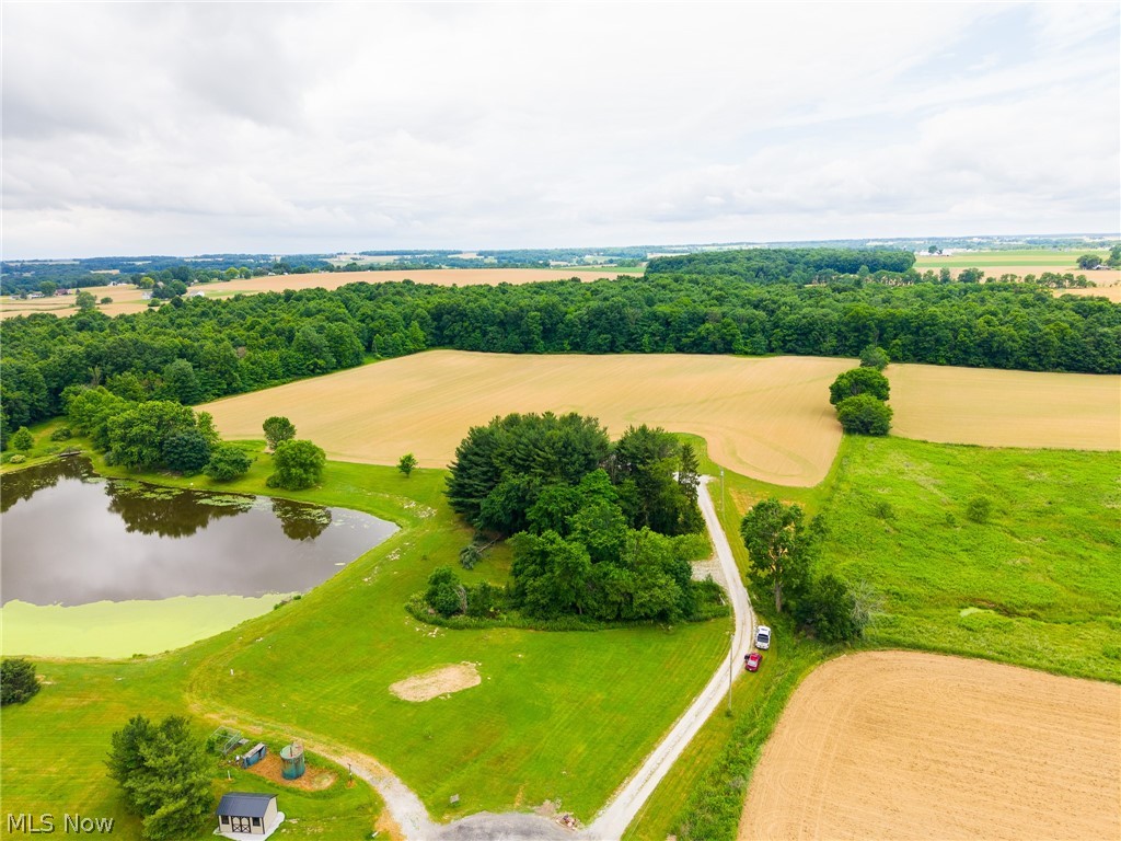 Onsite Absolute Auction, Tuesday July 31st at 6:00 PM. The address shown is not the actual mailing address for this lot. It is the home located directly in front of the property and is being used for location reference only. The home at that address is not for sale. This lot consists of 24.528 acres with approximately 12.4 wooded acres and the balance in productive tillable ground. The land features rolling terrain, established trails, recreational opportunities, and long-term timber potential. The tillable acreage is currently farmed, with the tenant retaining rights to the current crop. The parcel has its own access from Hidden Lake Drive and is also served by a shared driveway.