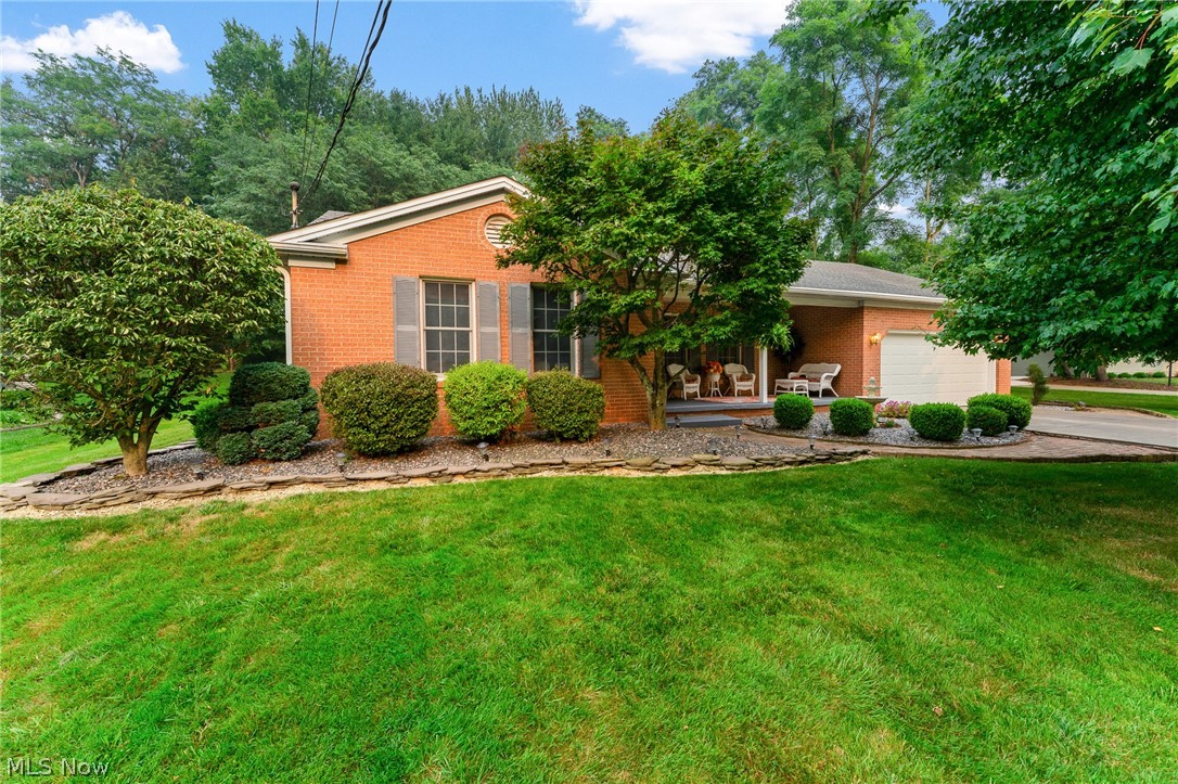Welcome home to this meticulously maintained 3-bedroom, 1.5-bath ranch nestled on a desirable street in Poland. This charming home offers a spacious living room and a bright eat-in kitchen featuring an abundance of counter space, perfect for everyday living and entertaining. The generous primary suite includes a private half bath and walk-in closet, while two additional bedrooms showcase beautiful hardwood floors. The full bath features a tub/shower combination. Relax in the inviting family room with beamed ceilings, hardwood floors, a cozy fireplace, and a sliding glass door leading to a concrete patio overlooking the nicely landscaped backyard complete with a storage shed. A covered front porch with a brick walkway creates wonderful curb appeal. Additional features include a two-car attached garage with durable epoxy floors, a full basement offering ample storage and a dedicated laundry area. Recent updates provide added peace of mind, including a new garage door (2023), freshly painted basement floors and walls (2024), sump pump, garage screen door, GFCI's, epoxy garage floor, new carpet living room and primary bedroom (2025), and new toilets, dishwasher, and dehumidifier (2026). One year home warranty for your peace of mind. This move-in-ready home combines comfort, quality, and pride of ownership in a fantastic Poland location.