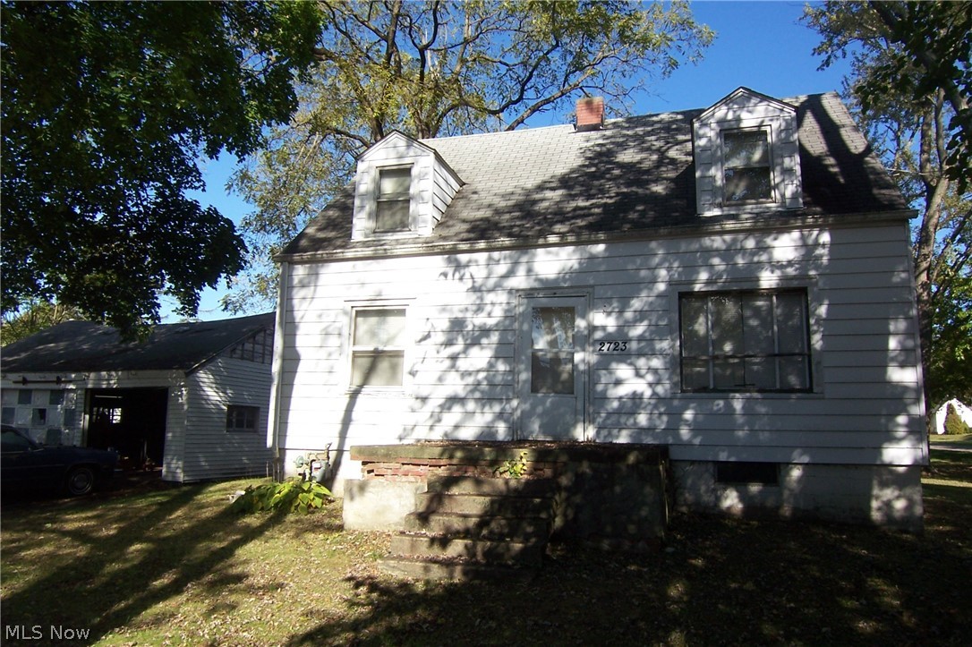 Potential! 3 bed on 3 lots with 3 car garage! Needs work! Full walkout basement! Garage has 220 line! Some hardwood floors! Rear deck/storage shed! City water & sewer!