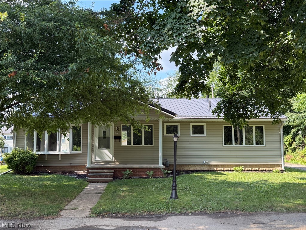 Looking for 1 floor living? This is the home for you. 3 bedrooms and 3 bathrooms on a large corner lot on the end of a quiet street. The exterior features a newer metal roof and recently installed vinyl siding. There is also an attached 2 car carport with additional parking next to it. A nice front porch and a rear deck complete the exterior. Inside you'll find a completely remodeled, move in ready home. All new kitchen and bathrooms. New flooring throughout. The entire main level has been freshly painted. Laundry is on the main level as well. Very large, updated basement that can easily be used for extra living space. Call a licensed agent today for a private showing