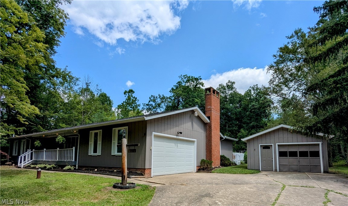 Welcome to 907 Circlewood Dr in Aurora. This 3 bedroom, 2.5 bath ranch is nestled on a 1.2 acre lot in a beautiful wooded neighborhood. Walk up to the cozy-covered front porch and main entrance to the spacious entry foyer. The living room has a vaulted ceiling and bay window overlooking the wooded front yard. The master bedroom has two closet areas and ensuite. Each of the remaining 2 bedrooms boasts double closets. The dining room has a vaulted ceiling and bay window that overlooks the private backyard. The eat-in kitchen features a vaulted ceiling with skylight, coffee bar, pantry, recessed lighting and pendant light over a table area. All appliances stay. There is a first floor laundry across from a half bath that leads to the extra large family room. It features a wood burning fireplace, dry bar, additional closet space and natural light coming from the rear windows and access to a large wood deck that's great for entertaining. The backyard is open to a play area with plenty of room for a large garden. Besides the attached 2 car garage, there is an additional detached garage for all your toys! The basement has a generous workroom as well as a partitioned second room just waiting for you to design your own entertainment and additional living area!