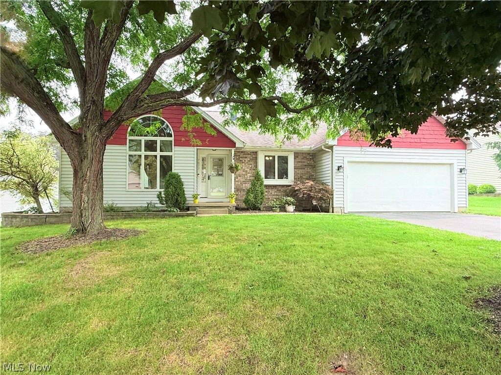 Welcome home to this beautiful 3 bedroom, 2 full bath ranch in the heart of Boardman! Offering 1,479 square feet of comfortable living space, this home is situated on an approximately 0.35 acre lot with a spacious backyard, deck, and storage shed. The stunning updated eat in kitchen features granite countertops, beautiful cabinetry, a decorative ceramic tile backsplash, ceramic tile flooring. Cathedral ceilings enhance both the kitchen and living room, creating an open, airy feel. The living room is highlighted by a beautiful Palladian window that fills the space with natural light, while sliding glass doors from the kitchen lead to the deck, making indoor and outdoor entertaining a breeze. The owner's suite offers two closets and a private full bath. Not to mention an attached two car garage. Also, located in a convenient location near shopping, dining, parks, and schools that complete this exceptional Boardman home. Don't miss your opportunity to make it yours!