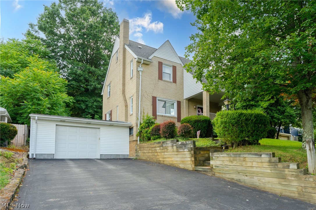 Looking for a well maintained, brick house in East Liverpool? Don't miss on this one! This house has a lot to offer! As you drive up to the house, you'll pull into a double wide black top drive way that leads to an oversized garage. The garage has access to the finished basement with ceramic tile and tons of space for an additional living space. Updated full bathroom with a jacuzzi tub and walk in shower. Laundry room with lots of storage. Upstairs on the main level offers a beautiful kitchen with solid wood cabinets, laminate countertops and a custom backsplash. The large dining room nests off the kitchen and leads into the wonderful spacious living room with a beautiful crafted fireplace. The second floor offers 3 bedrooms, nice closet space in each. The master has double closets and sits next to the other full bathroom that that's perfect for the family. The third floor has potential of being a 4th bedroom but currently used for storage. Big lot over a half acre. Vinyl windows throu