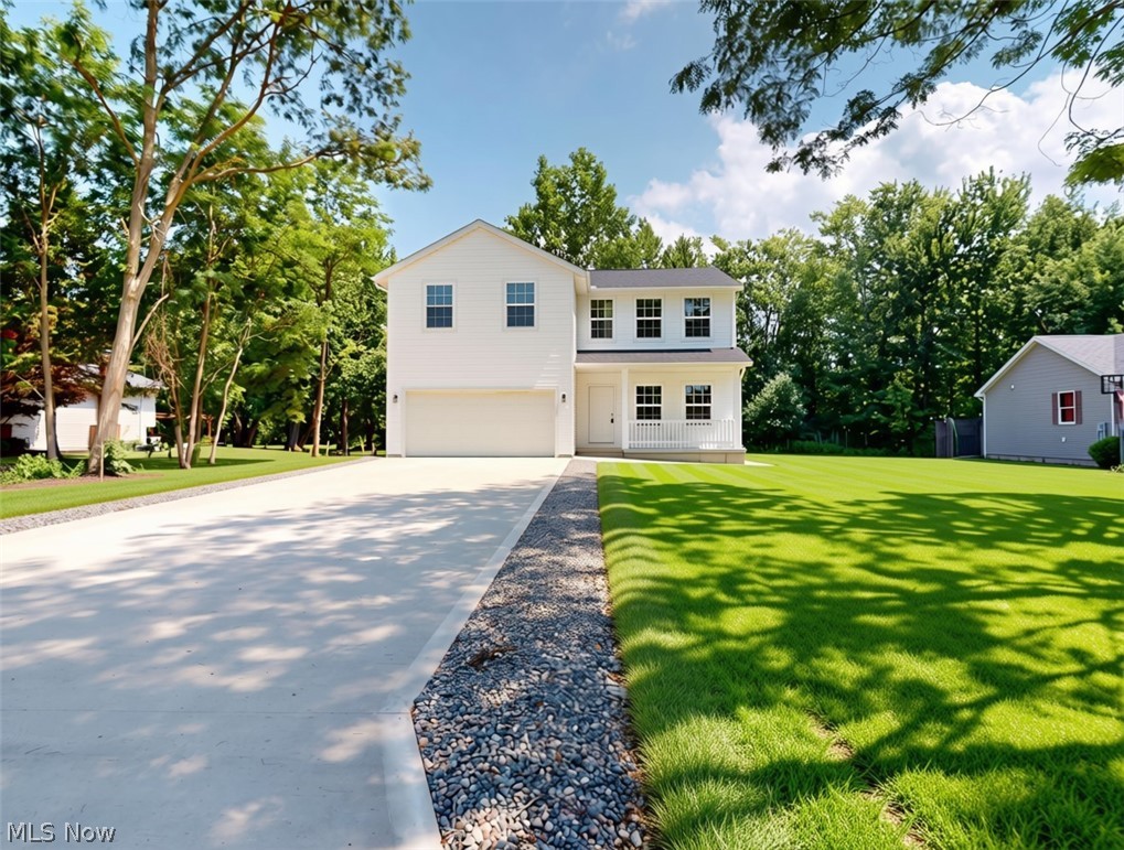 BRAND NEW HOME without the wait! Welcome to this amazing opportunity in Madison Village! Located in one of the most desirable, established neighborhoods in Madison. No detailed missed here, 4 bedrooms with large walk-in closets in each bedroom, EXPANSIVE owner suite with tons of natural light, large walk in closet and en suite bathroom, additional full bathroom on the second level and a half bath on the main floor, open concept main floor living area, full kitchen island, brand-new stainless-steel appliances, sliding door off the kitchen opens up to the outdoor deck overlooking the large lot backed up to a private wooded space perfect place to enjoy your morning coffee, enjoy meals or relax in the great outdoors! The lower-level finished space is perfect for an additional living room, office, playroom- the possibilities are endless! Make this home yours just in time to enjoy all that Madison Village has to offer including summer concerts, outdoor markets, various outdoor events in the Village and so much more. Conveniently located minutes from I-90, Fitness centers, schools, shopping, Metroparks, wineries, restaurants, medical centers and just about a 40-minute drive to Downtown Cleveland- Schedule you're showing today. **SOME PHOTOS ARE VIRTUALLY STAGED**