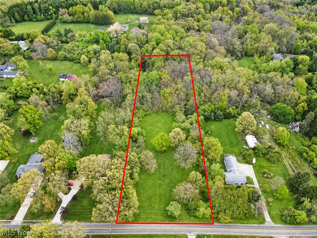 Location, location, location! Nestled in the highly desirable Bath Township within the acclaimed Revere Local School District, this 3.67 acre property offers multiple opportunities for a building site across the land. The topography features a mix of flat, rolling, and ravined land toward the rear, with potential for a walkout lower level design. The property offers scenic character and endless potential for a custom build, featuring mature trees, rolling hillside terrain, and a peaceful spring/creek. Conveniently located just minutes from Bath Nature Preserve, Sand Run Metro Park, and the Cuyahoga Valley National Park area, outdoor recreation is close at hand. The property also offers convenient access to I-77 and Route 18 while remaining near shopping, dining, and everyday conveniences at Montrose and Fairlawn.