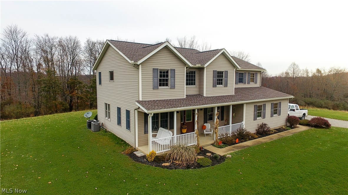 Custom home in beautiful country setting! This 3/4 bedroom 2.5 bath home sits on over 12 acres and has picturesque views of the valley.  The downstairs of the home features open concept living room and kitchen perfect for entertaining, walk in pantry, formal dining room, sun room leading out to back deck, office (could also be first floor bedroom) and half bath.  Upstairs you will find a large master suite with walk in closet, jacuzzi tub, shower and double sink.  There are also 2 additional bedrooms, a large laundry room, full bath, and a multi purpose space that could be kids play area, craft space or reading nook.  New roof in 2016.  Property also includes a 1500 sq. ft horse barn with 2 large box stalls, riding arena, and a portion of the property is fenced.  If you are looking for a home with acreage yet still close to city amenities check out this homestead! Close to Atwood Lake! Additional 3.5 acres available to the right of the lane at the road.  Motivated Seller