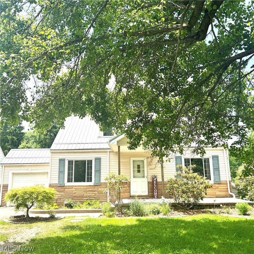 Welcome to this enchanting Cape Cod in a desirable area of Hubbard Township! Step inside to the open space of the combined living room and dining room, perfect for formal meals or relaxing evenings at home. The spacious eat-in kitchen offers abundant storage, beautiful cabinetry, breakfast bar and functionality with sliding glass doors that lead to a covered deck. The ideal spot to enjoy your morning coffee or evening beverage. There is a hook up for a stackable washer and dryer in the kitchen area that can be easily converted to a pantry. The main floor features an ample sized bedroom and updated full bath. Upstairs, you’ll find two more generously sized bedrooms connected by a Jack-and-Jill full bathroom, along with walk-in closets and plenty of storage space throughout. New metal roof (2025) New furnace (2024) New well pump (2024) updated tilt-in vinyl insulated windows and newer water heater. The garage features French doors leading out to the back yard, perfect set-up for a party. This move-in ready, clean and updated home will give you peace of mind for years to come with all the major costly components recently replaced. Sit back and reap the benefits of your new dream home. No septic replacement is needed, the area is on the upcoming sanitary sewer line project currently slated for 2028. Home does not have central air. Seller has also done some recent additional home repairs, receipts can be provided.