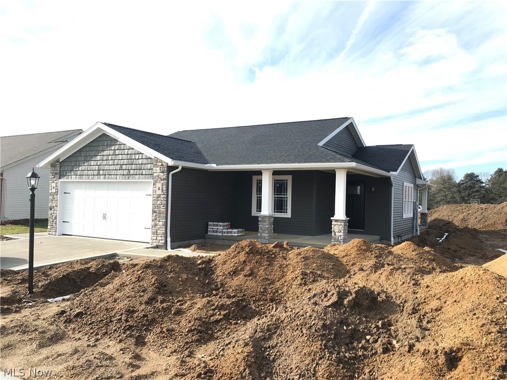 Quality built stone and vinyl ranch.  3 bedrooms, 2 full baths.  Open floor plan with dark poplar trim.  Dark maple kitchen with wood laminate floors.  First floor laundry room.  Full 12 course basement plumbed for a bath.  14 X 12 covered rear patio.  2 car attached garage.  Radon system installed by builder.  Built by Lawver Construction.  Taxes reflect the land only.  Room sizes are estimates.