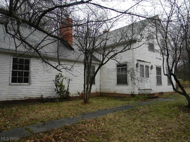 This is a Fannie Mae Homepath property. 4 bedroom, 4 fireplaces, 2 1/2 bath home 1.66 acres. Attached 2 car garage, screened in porch, big basement, corner lot and driveway access on both roads.  Approximately 10 minutes to shopping, dining and direct freeway access to downtown Cleveland.