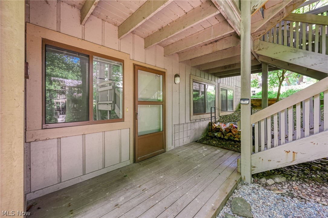 Surrounded by a peaceful wooded setting, this beautiful designer-inspired first-floor condo in the desirable Pine Mill Ridge #4 community, offers the perfect blend of privacy, comfort, and modern living.   This first-floor 2-bedroom 2-full bath home offers an open, inviting floor plan designed for comfortable living and easy entertaining. The living room features a cozy wood-burning fireplace, while the stunning remodeled kitchen showcases quartz countertops, custom cabinetry, newer appliances, and a breakfast bar. The adjoining dining area includes additional custom cabinetry with matching quartz countertops for extra storage and serving space.
The spacious family room opens through sliding doors to a private covered deck overlooking a peaceful wooded setting. The owner's suite offers double closets and a beautifully updated en-suite bath. A generously sized second bedroom and an updated full bath provide the perfect space for guests, family, or a home office. Both bathrooms have been fully updated with new showers, vanities, toilets, lighting, and fixtures. A convenient laundry area with ample storage completes the home.  Freshly painted 7/26 and AC new in 2025. Residents also enjoy access to the community pool, offering the perfect place to relax, unwind, and enjoy the warmer months... Call your realtor for a private showing today.
