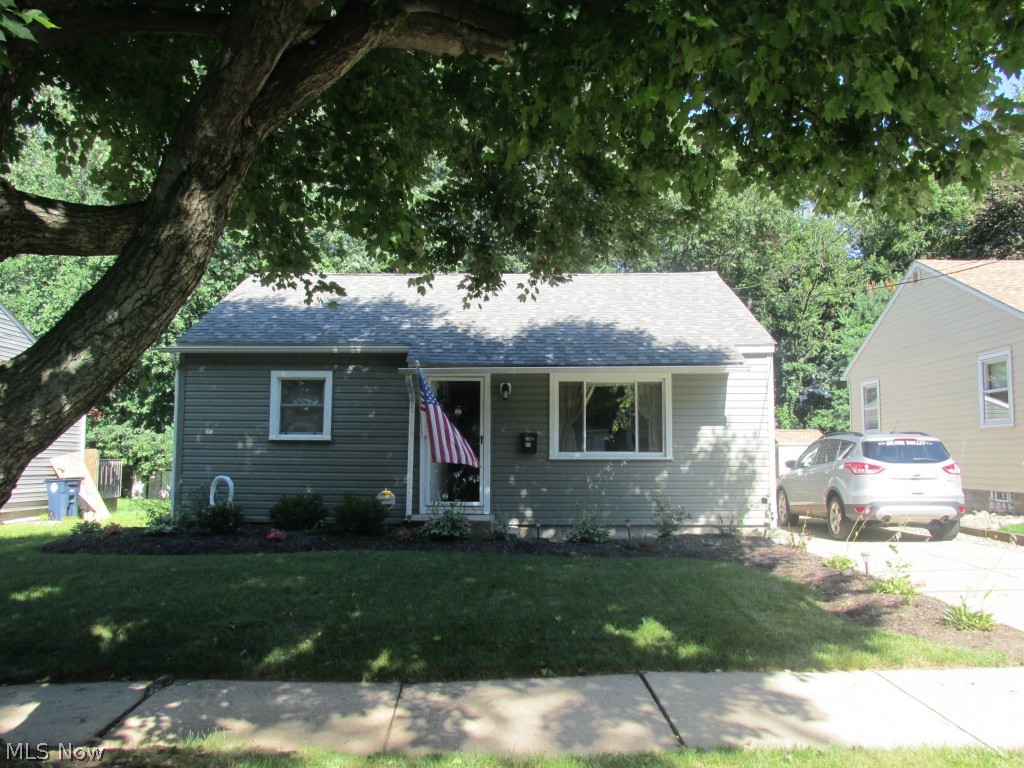 Completely Updated Top-to-Bottom in 2009 with more recent improvements.    Beautiful wood floorings in kitchen, living, bath and hallways for easy-care living.     Very nice knock-down textured ceilings.    Concrete drive, one care garage has new door opener, glass block windows and workbench.    Wood privacy fenced backyard for outdoor entertaining plus 16x16 paver-block patio on level 50 x 140 lot.    Efficient low utilities makes this home a great find.       Appliances included refrigerator, stove, microwave, washer, dryer, central air, and security system.    Curtains & blinds also included.    Tastefully decorated with modern colors. Bedrooms are carpeted.   Nice perennials.    This home is easy to enjoy all year round.