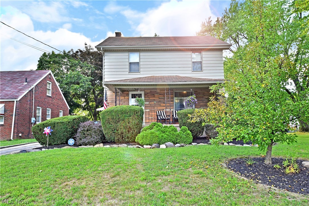 Hurry in, this perfectly charming three-bedroom Youngstown home won’t last long! With two and a half floors of finished living space to include a basement level bonus room and second full bath, this residence checks all the right boxes. Manicured landscaping runs beneath the tall trees as a covered front patio provides plenty of curb appeal along with warm weather relaxation. The concrete drive stretches back to a detached single car garage with a bonus storage shed. Step inside the front door to find a welcoming foyer as the thick, stained woodwork continues up the carpeted staircase. A lavish family room opens nearby to highlight a quartet of unique windows and brightly colored walls and carpet. A home office and delightful half bath sprawl around the far end of the room. Meanwhile, the impressive central kitchen brings additional bar top seating as it reveals a large dining area. Upstairs, a trio of spacious bedrooms include an oversized master. A second full bath completes the floo