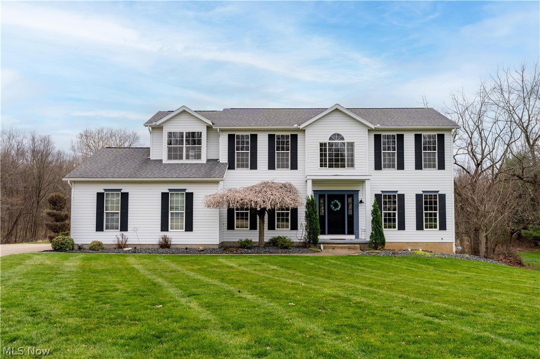 Welcome home to this beautiful Colonial tucked away at the end of a cul-de-sac in Jackson Township, offering the perfect blend of comfort, space, and functionality. The first floor and owner’s suite are both enhanced by 9-foot ceilings, creating an open, airy feel that elevates the home’s design. At the center of the home, the kitchen impresses with a large island and generous prep and gathering space. It transitions effortlessly into the formal dining room, making hosting feel natural, while sliding doors extend the living area outdoors to a spacious deck overlooking the private backyard. The great room is both inviting and comfortable, anchored by a fireplace and complemented by an adjacent office ideal for remote work or a quiet reading space. A first-floor laundry room and half bath add everyday convenience. The second level is equally well-appointed, featuring a spacious owner’s suite with a walk-in closet and an en suite bath complete with a soaking tub. Three additional bedrooms, a full bathroom, and a loft area complete this floor. The finished walk-out lower level enhances the home’s livability with newer carpeting and endless possibilities for recreation, entertaining, or additional living space, and is already plumbed for a future bathroom. Step outside to a stamped patio, perfect for gatherings or relaxing evenings by a fire. Set on a beautifully private lot, this home offers both privacy and space in a desirable setting while still being close to everyday conveniences. Schedule your showing today!