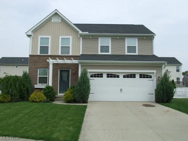 Modern Colonial on a professionally landscaped Cul-de-sac lot in Tallmadge.  Open floor plan features a great room with fireplace and dining area that's open to the kitchen.  The kitchen has stainless appliances and granite countertops, full pantry, and ceramic floors.  Two bedrooms share a full bath, plus a nice master bedroom suite, and second floor laundry with washer and dryer that stay.  All new flooring except in kitchen and main bath.  Partially finished basement has a beautiful rec room or possible media room with built in projector and large screen to enjoy your favorite movies and games. Fenced back yard with stone paver patio and professional landscaping.  Ready to move-in and enjoy today!
