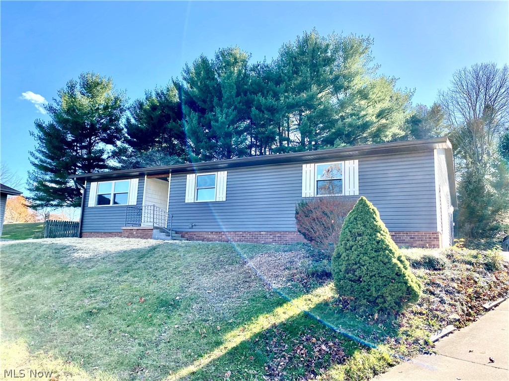 Beautifully remodeled ranch home located on the southside of New Philadelphia! This home was professionally renovated in 2020 and includes all new windows, roof, furnace and air, siding, paint, flooring, bathrooms, laundry, kitchen, fixtures and more! The home features almost 1900 sqft of living all on one level. 3 bedrooms including the master suite, 2 full bathrooms, the new kitchen has beautiful quartz counters, elevated bar, dining and tons of cabinet space. The kitchen opens to the large family room with custom brick, wood-burning fireplace. There is another living room and additional office/den or 4th bedroom. Main floor laundry area. Basement had been waterproofed and is drywalled. Attached 2-car garage with hot/cold water. plenty of storage space. 10'x16' deck off the back of the home offers privacy for entertaining or relaxing. A must see. Schedule an appointment soon!