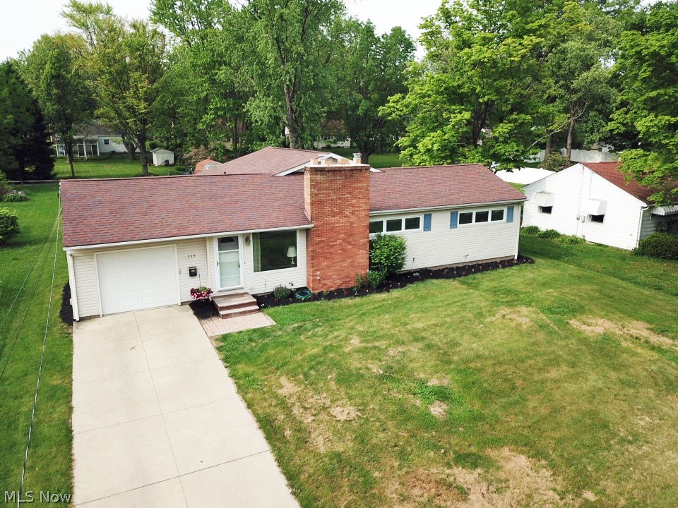 Lovely ranch with a beautiful, open kitchen and living room in Wadsworth! This home features four bedrooms, two full  and one half bathrooms, a finished basement, and an attached garage. A brick fireplace sits next to the picture window in the living room. A sliding glass door off the kitchen leads to a lifted deck overlooking a spacious, flat backyard. This house also has a newer roof. Comes with America's Preferred Home Warranty!  Don't miss out call today to schedule your private showing!